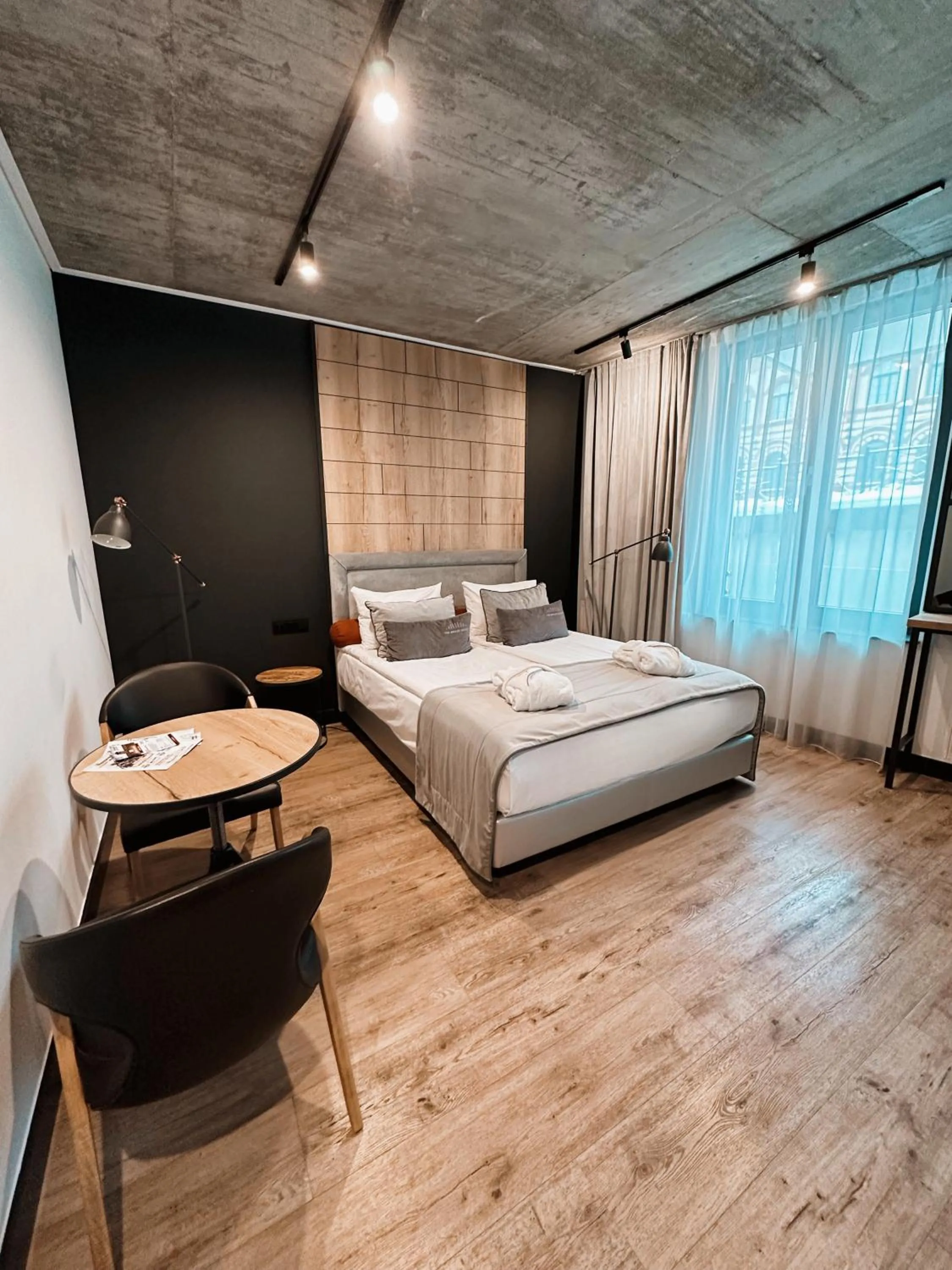 Photo of the whole room, Bed in The Bridge Suites Hotel