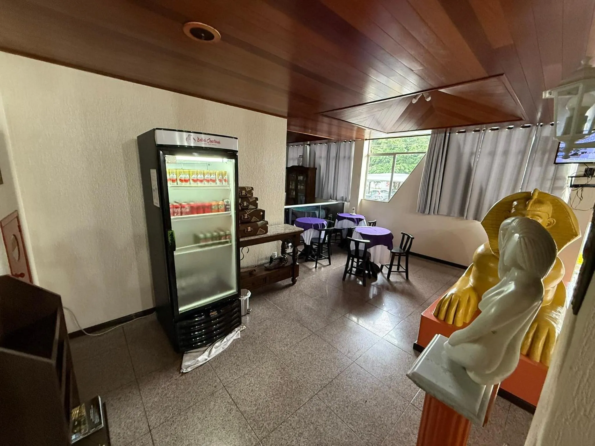 Communal lounge/ TV room in Oasis Chartouni Hotel