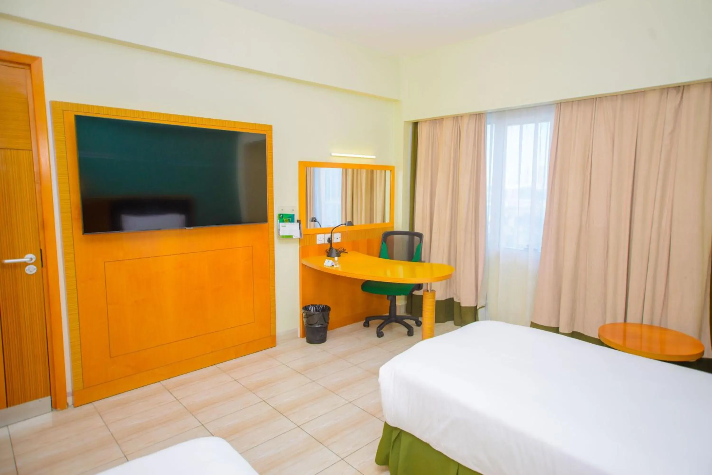 TV and multimedia, Bed in Holiday Inn Dar Es Salaam by IHG TV and multimedia, Bed in Holiday Inn Dar Es Salaam by IHG