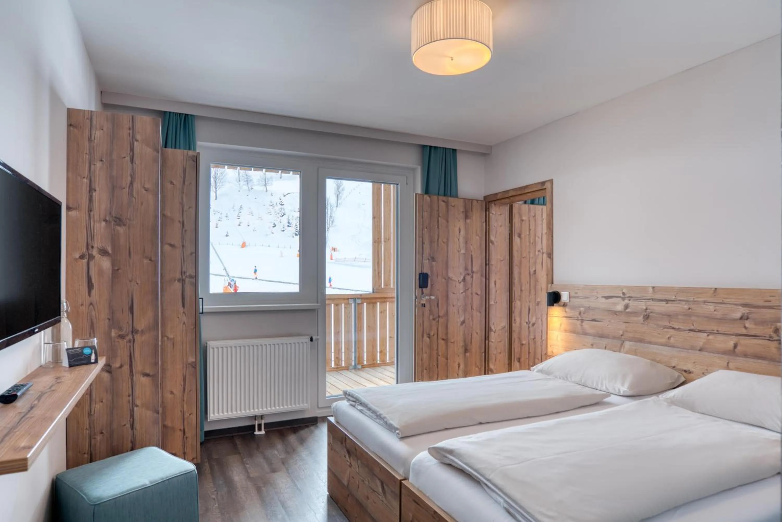 Photo of the whole room, Bed in COOEE alpin Hotel Bad Kleinkirchheim
