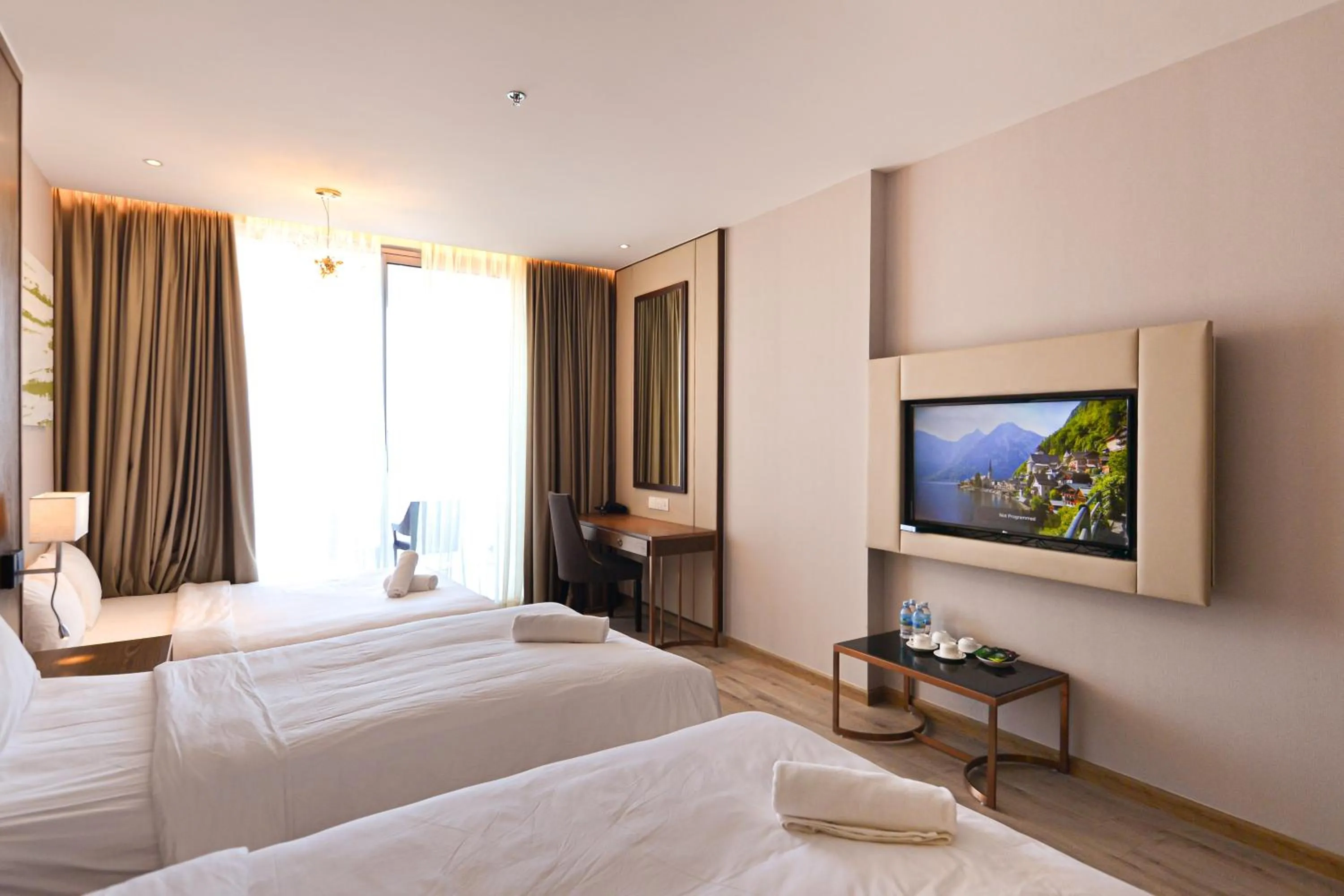 Bed in PANORAMA Condotel by HLG