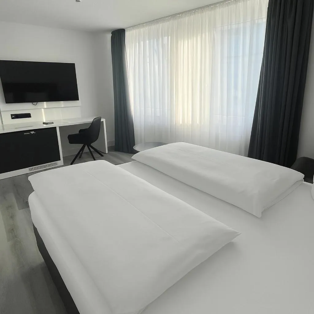Photo of the whole room, Bed in DORMERO Hotel Dessau-Roßlau
