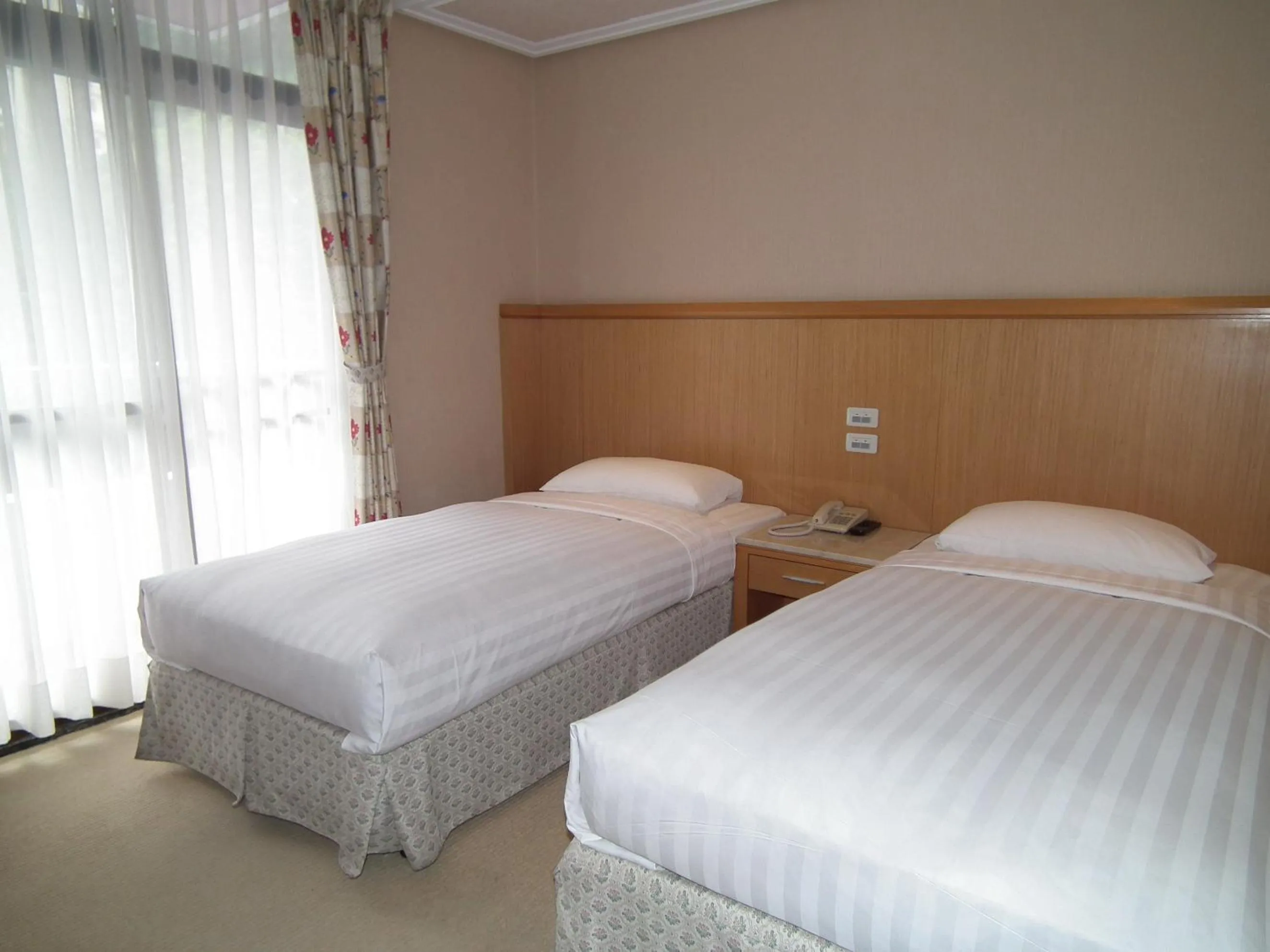 Bed in Honey Moon Hotel