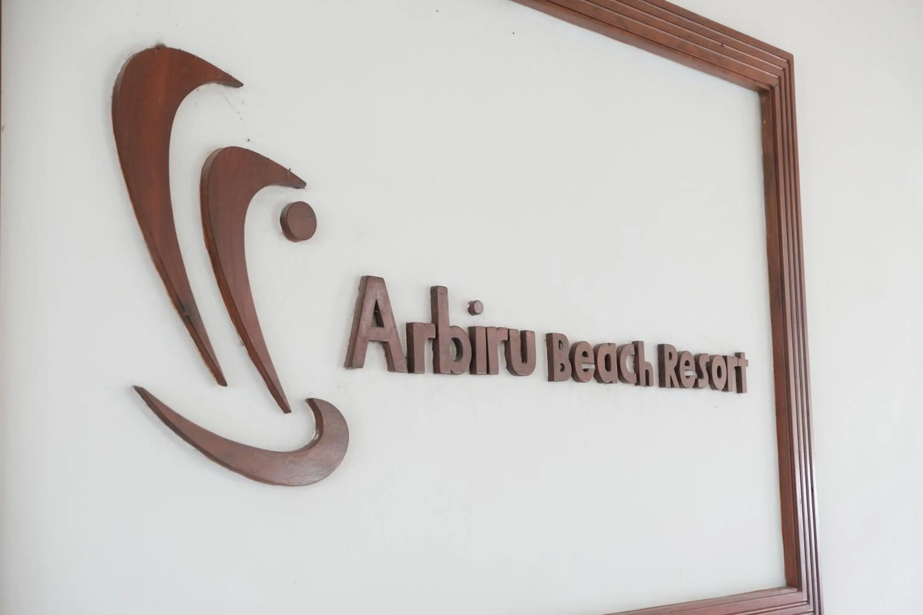 Property logo or sign in Arbiru Beach Resort