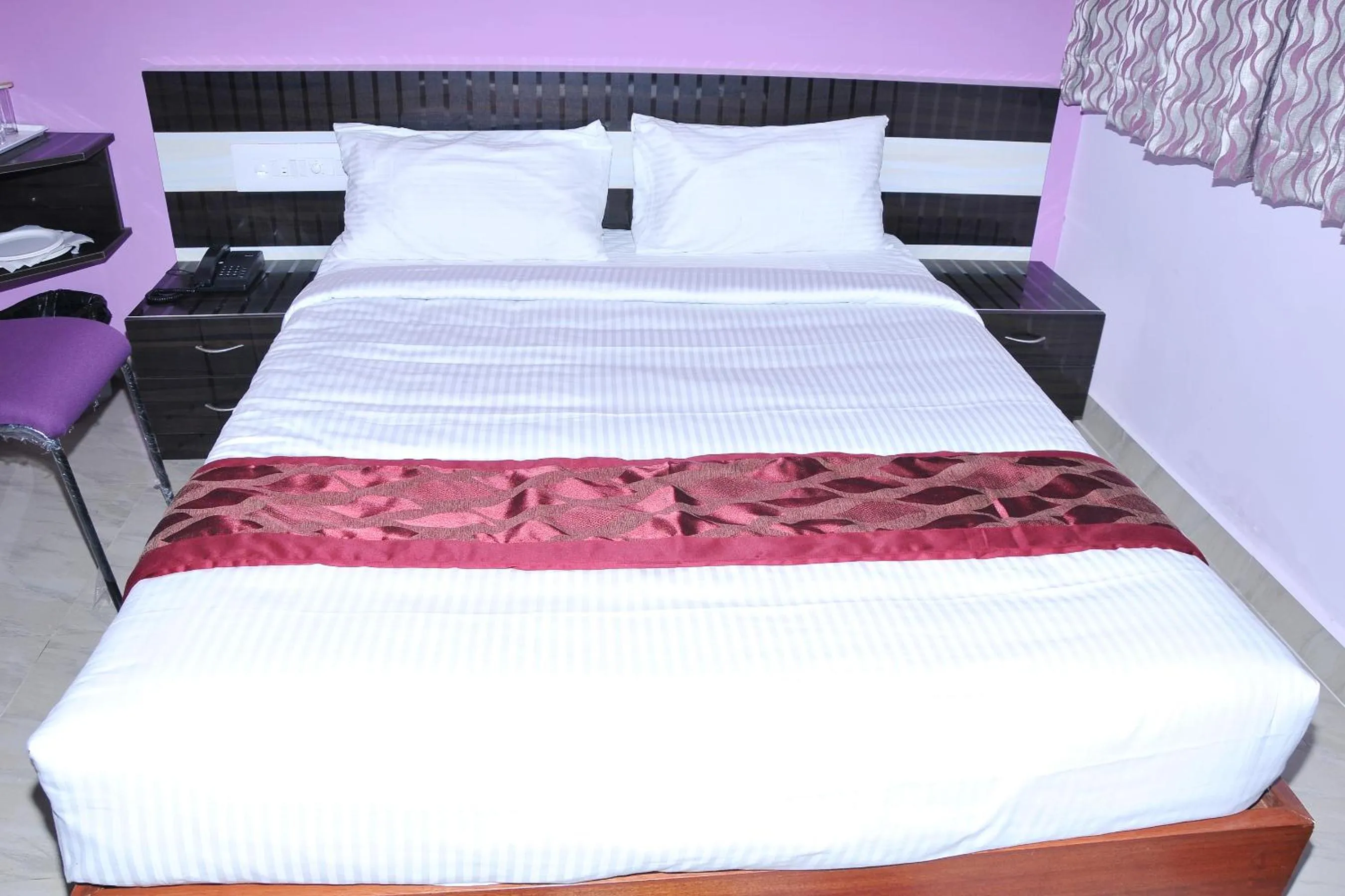Bed in Brahma Inn