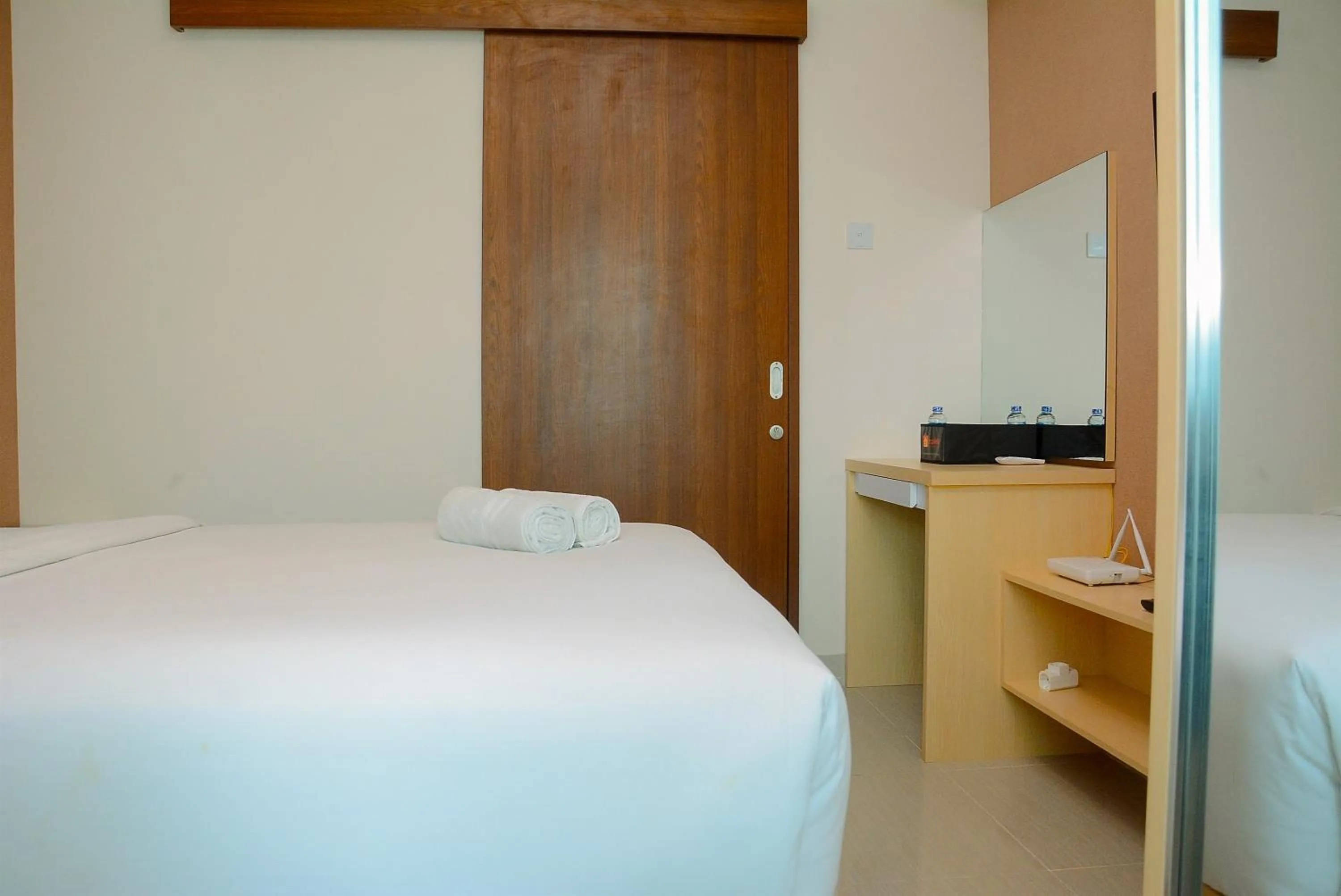 Minimalist and Homey 1BR Grand Kamala Lagoon Apartment By Travelio