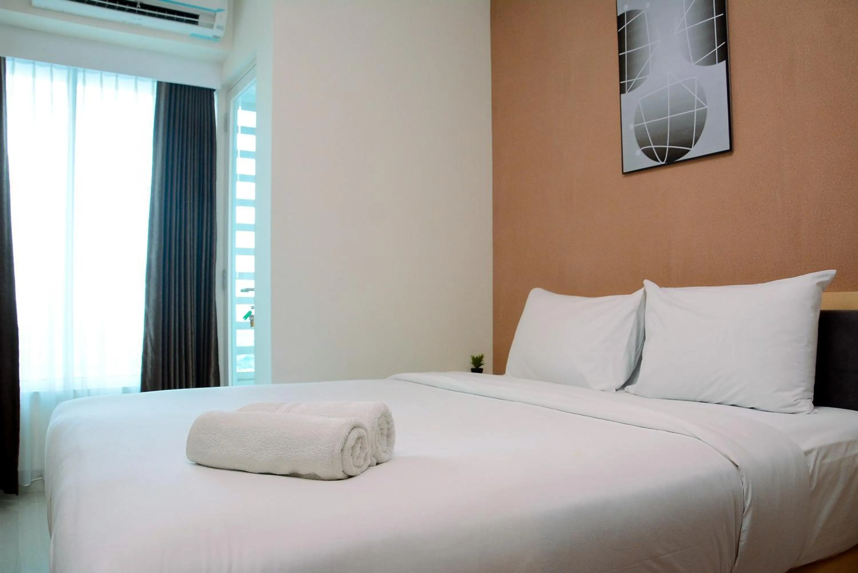 One-Bedroom Apartment in Minimalist and Homey 1BR Grand Kamala Lagoon Apartment By Travelio