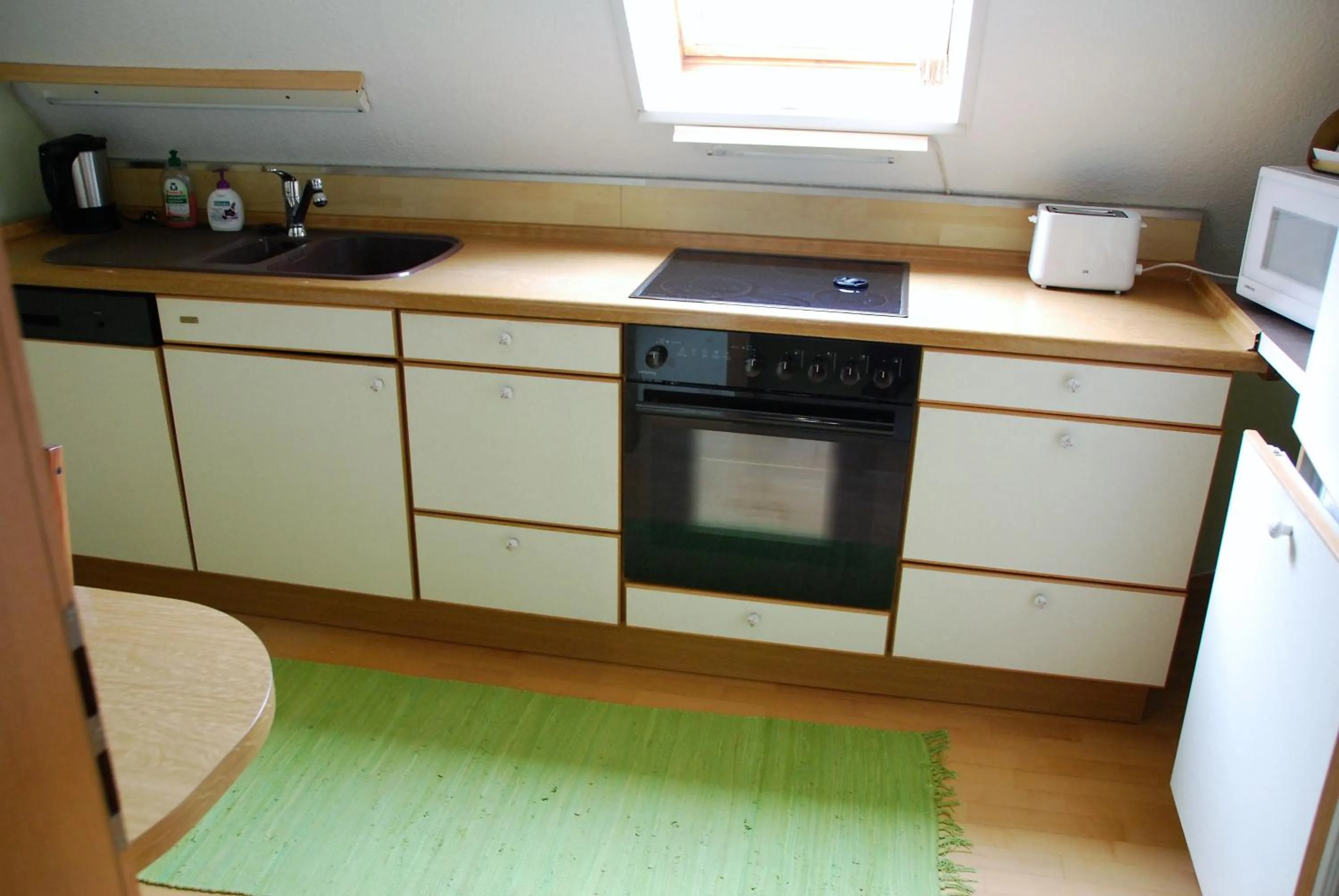 Kitchen or kitchenette in ambiente solutions apartments