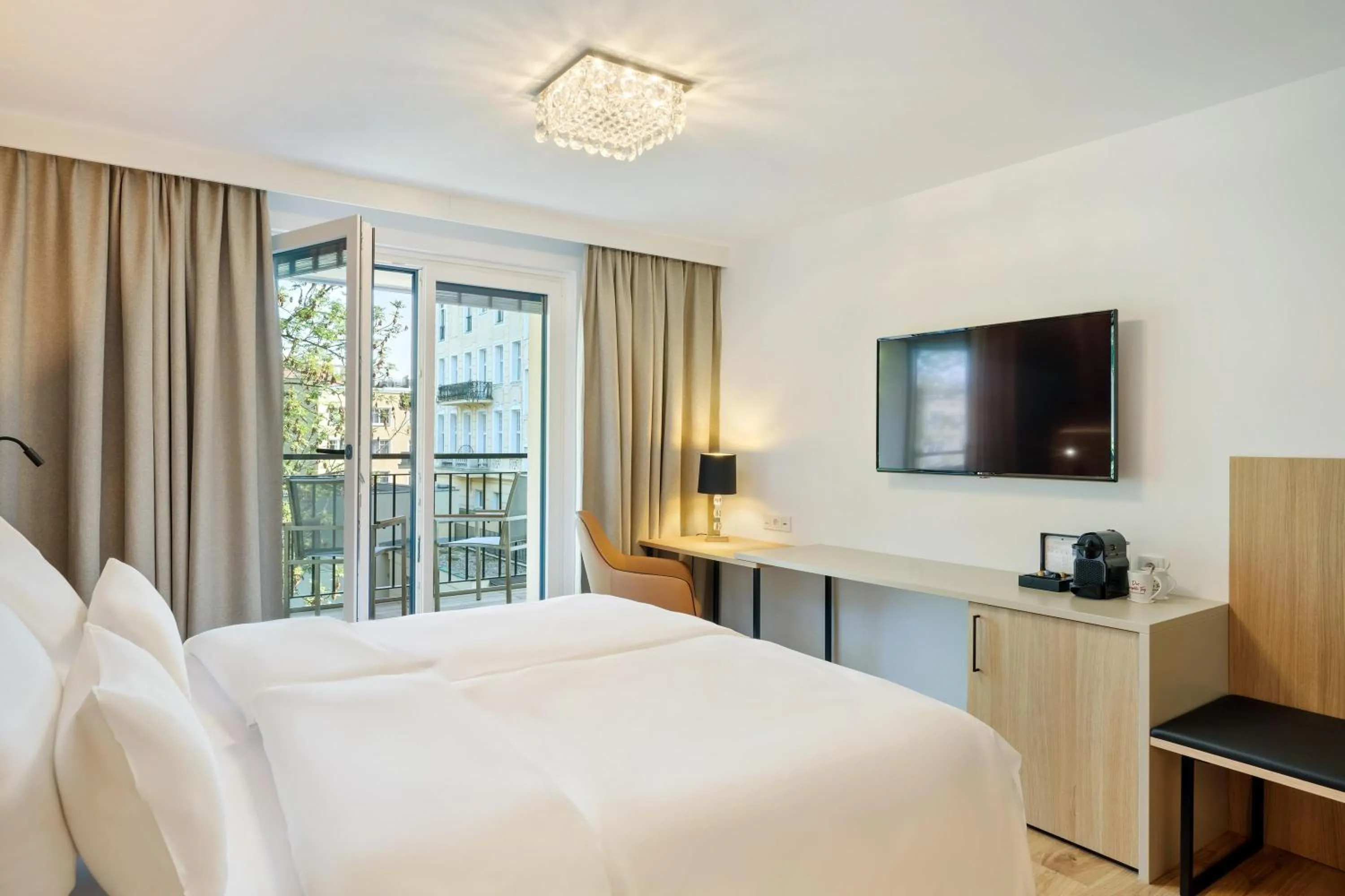 Photo of the whole room, Bed in Austria Trend Hotel Maximilian