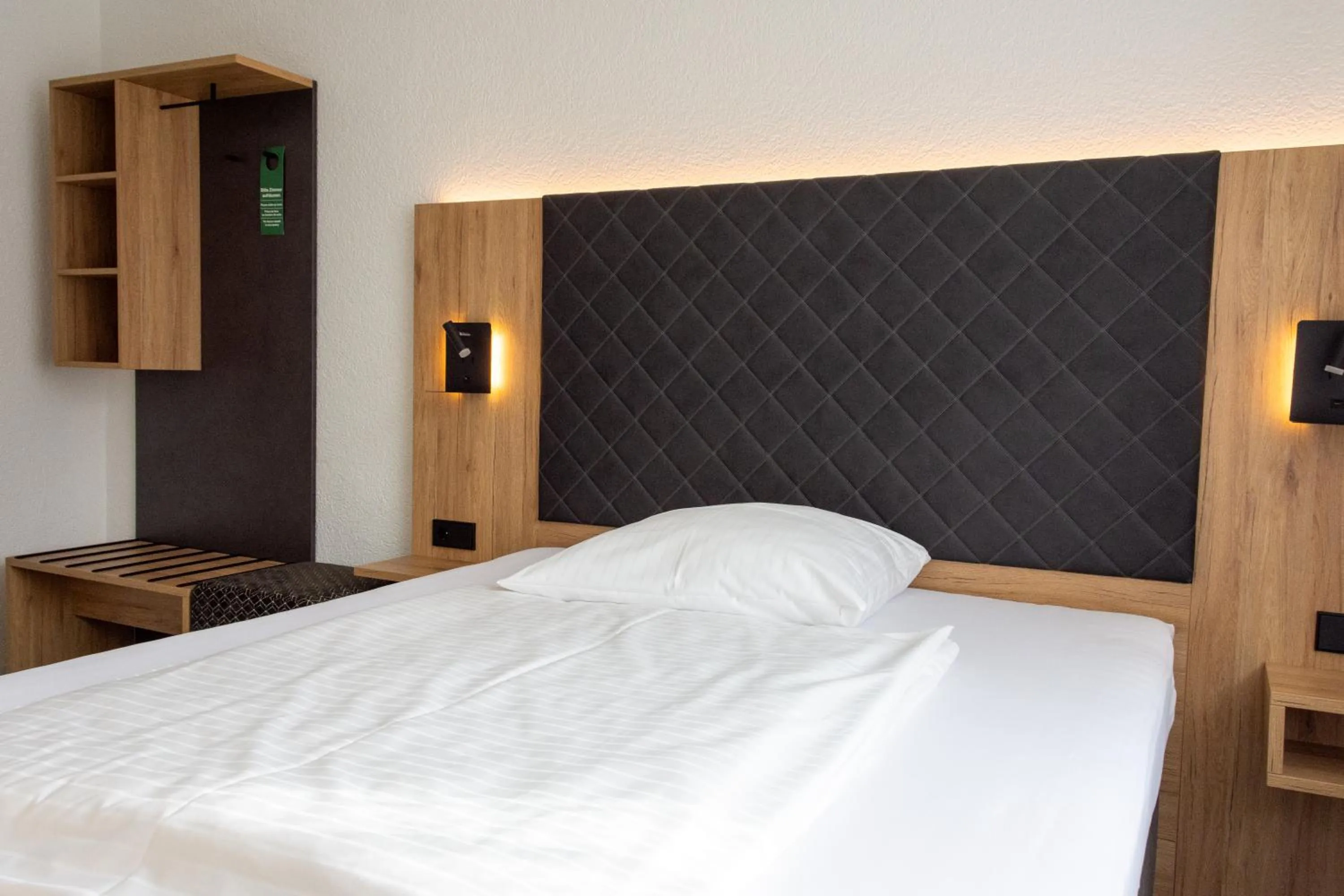 Bed in Hotel-Cocco-Bello in der Villa Foret