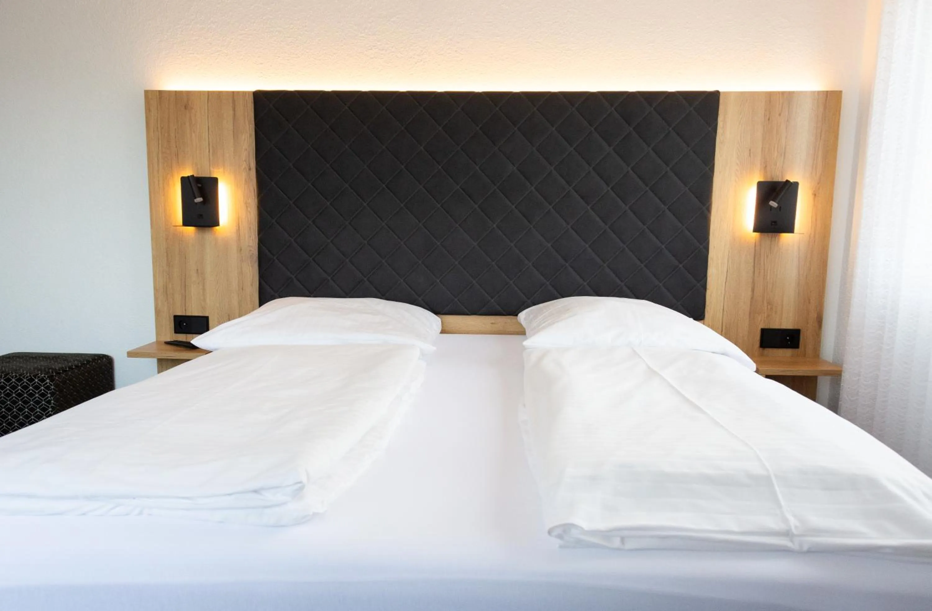 Bed in Hotel-Cocco-Bello in der Villa Foret