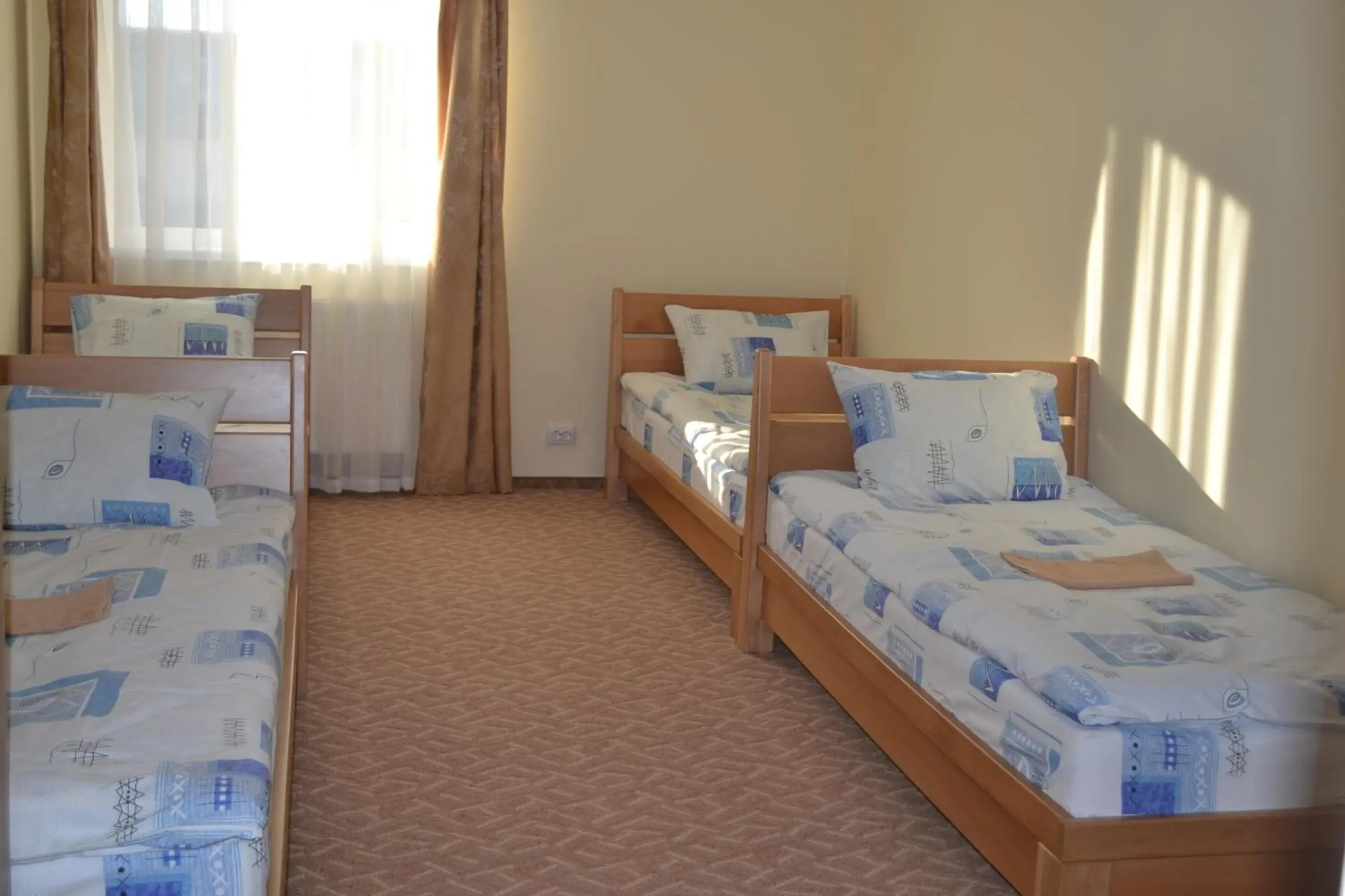 Standard Triple Room in Tonal Standard Triple Room in Tonal