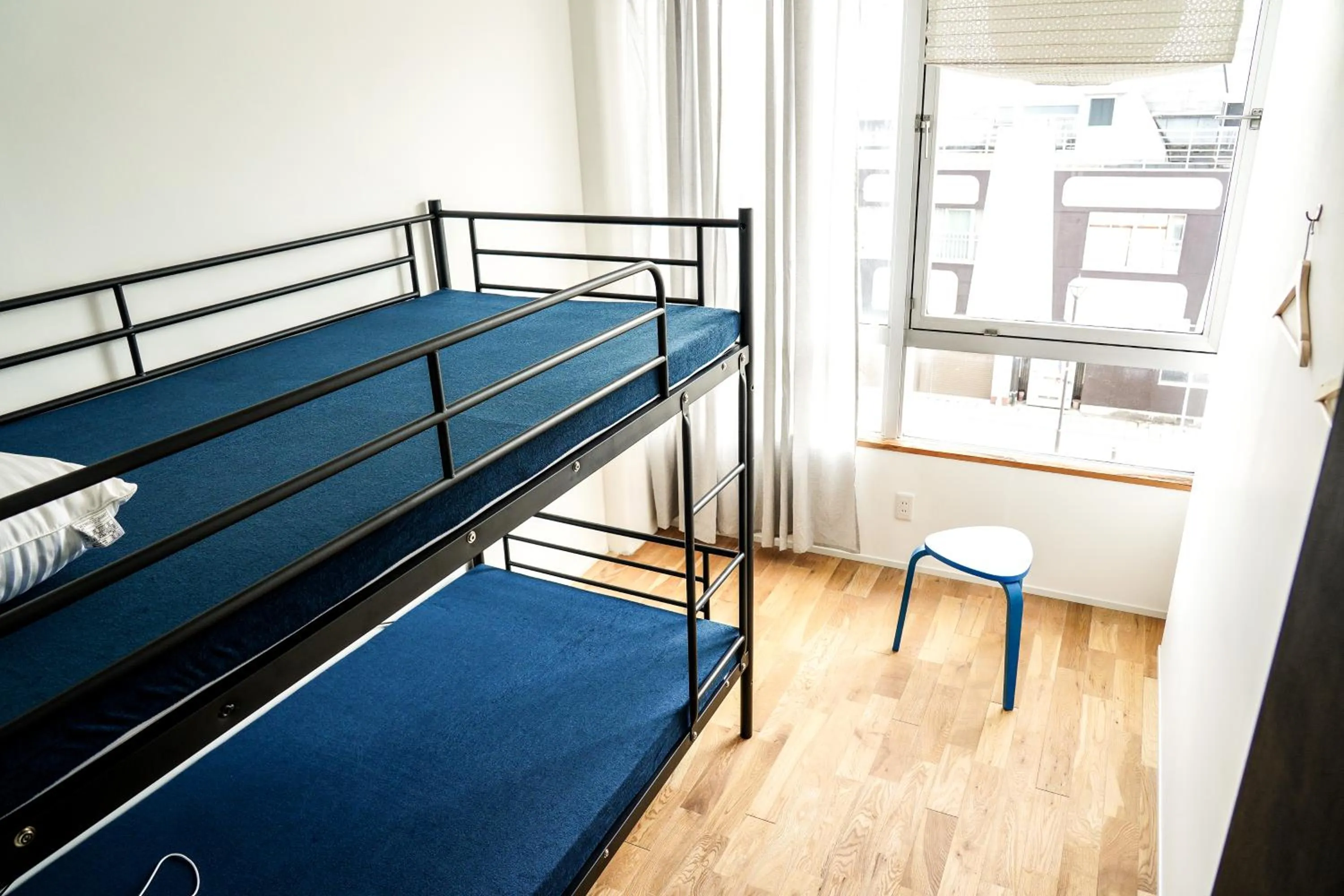 Bed in 商店街で暮らすように泊まる-アラシマホステル-