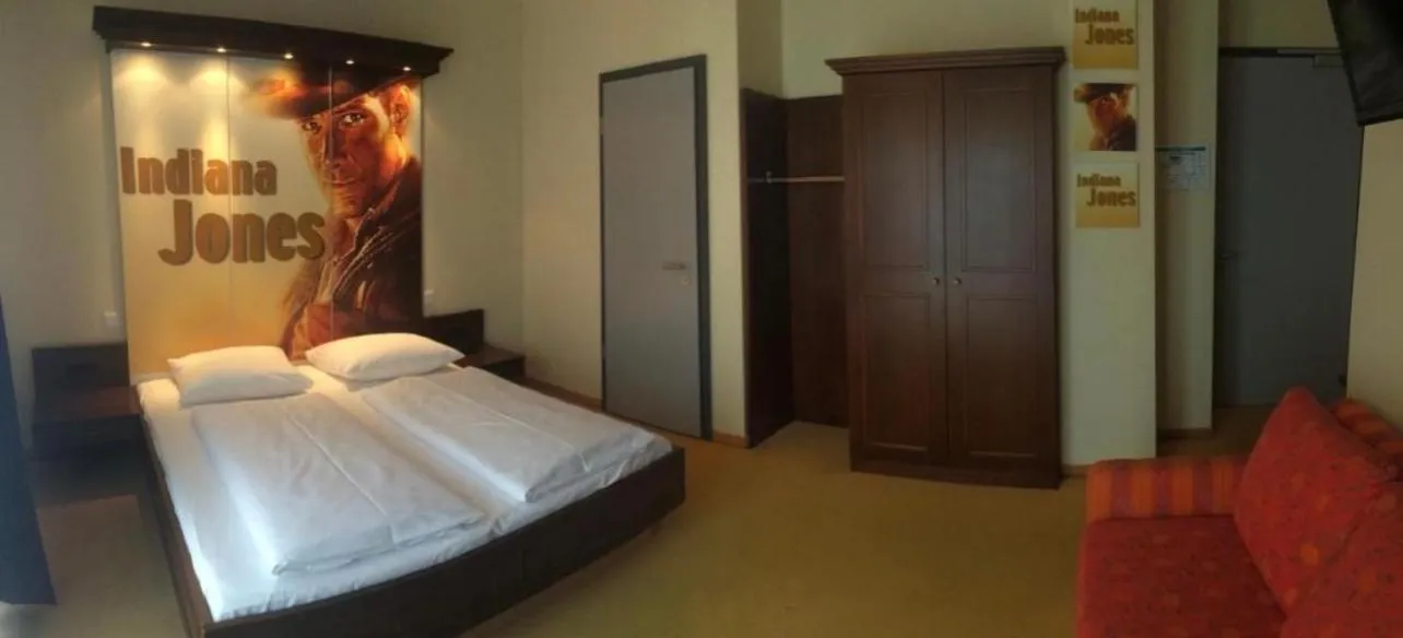 Bed in CineHotel Maroni