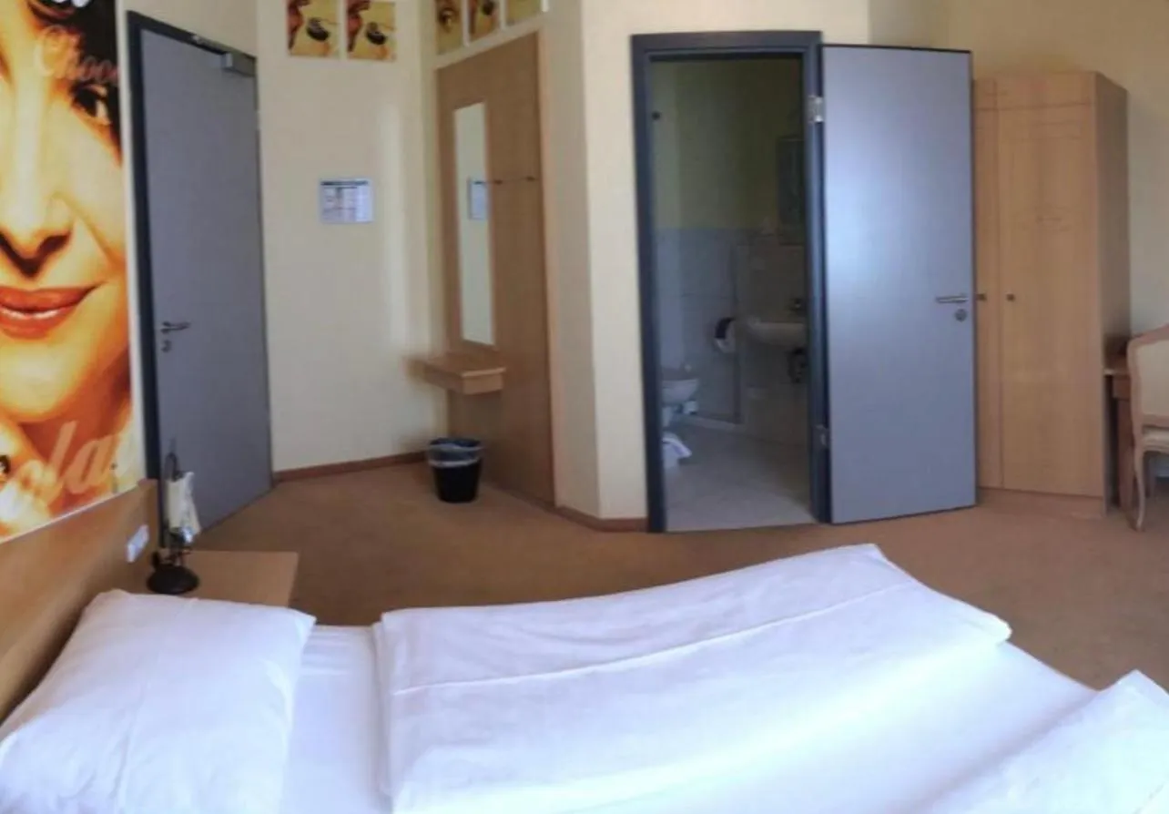 Bed in CineHotel Maroni