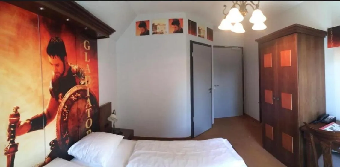 Bed in CineHotel Maroni