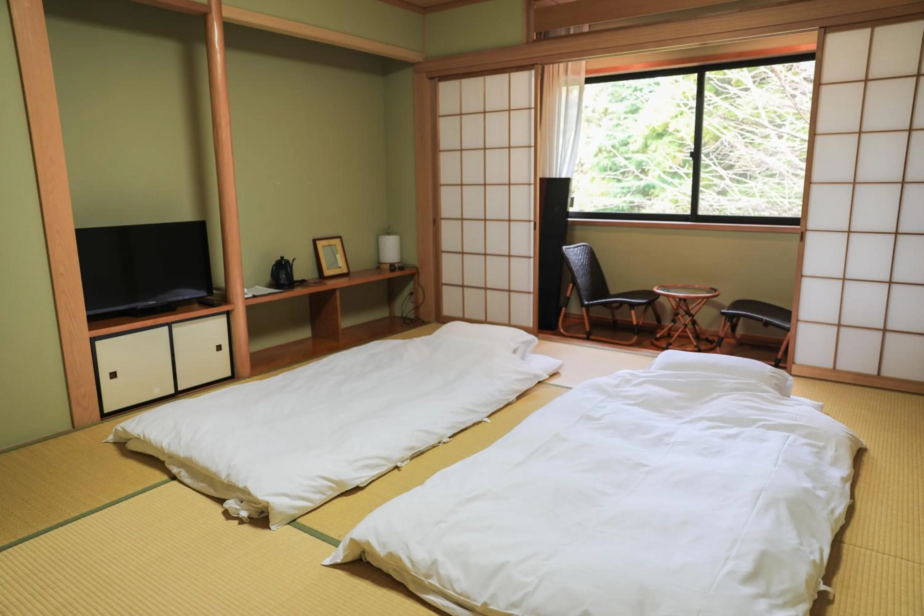Bed in Ajisai Onsen Ryokan - Award Winning Private Open Air Onsen