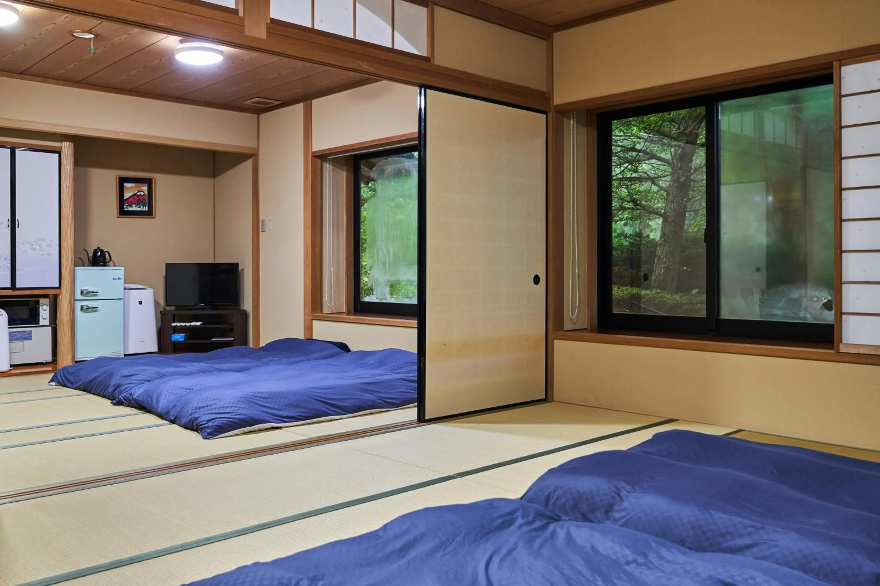 Bed in Ajisai Onsen Ryokan - Award Winning Private Open Air Onsen