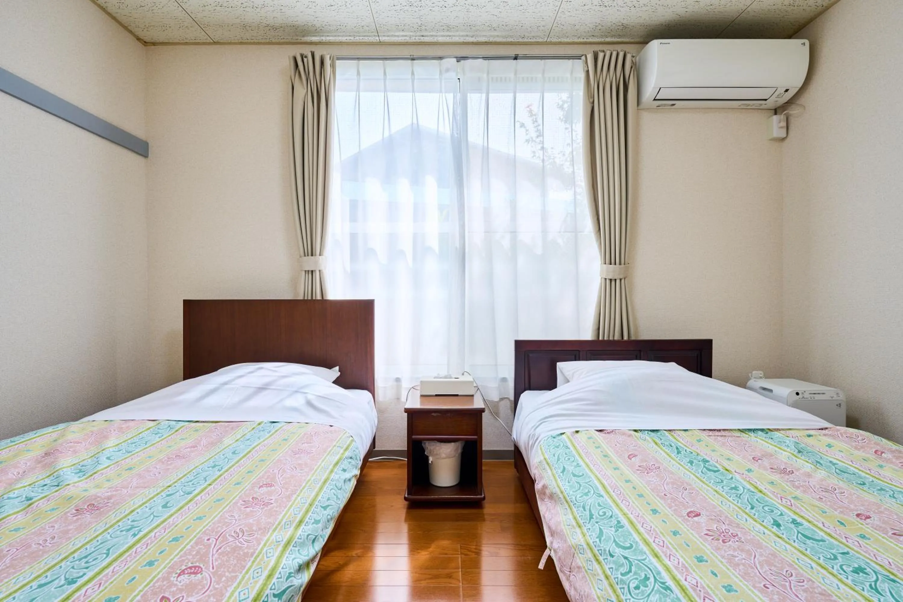 Bed in Enoshima Apartment Hotel