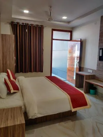Bed in Komal Inn