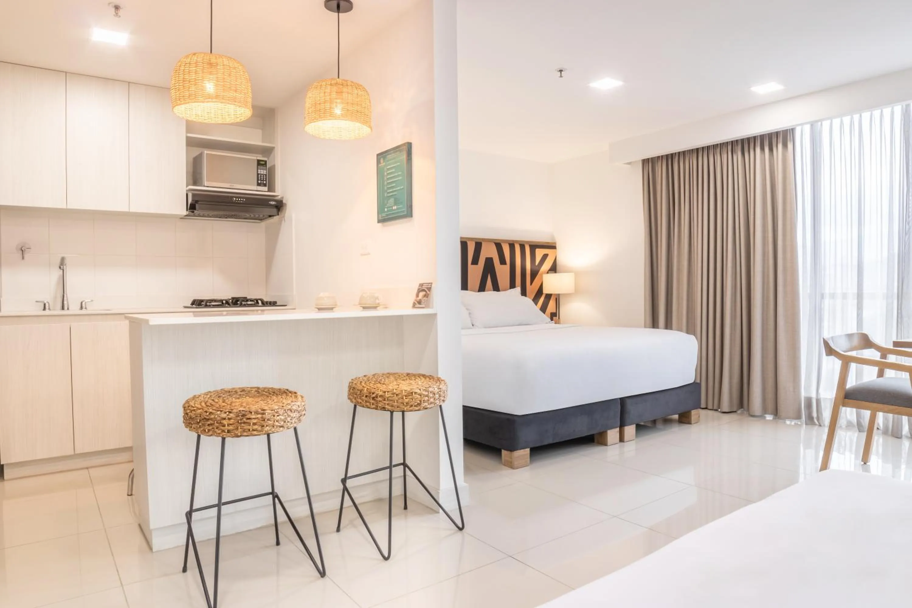 Bed in Origen Local Suites