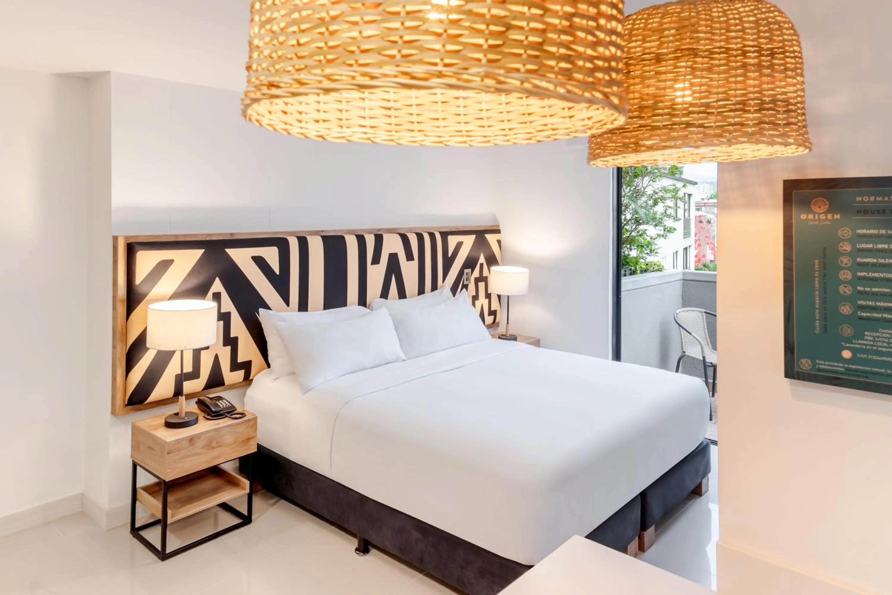 Bed in Origen Local Suites