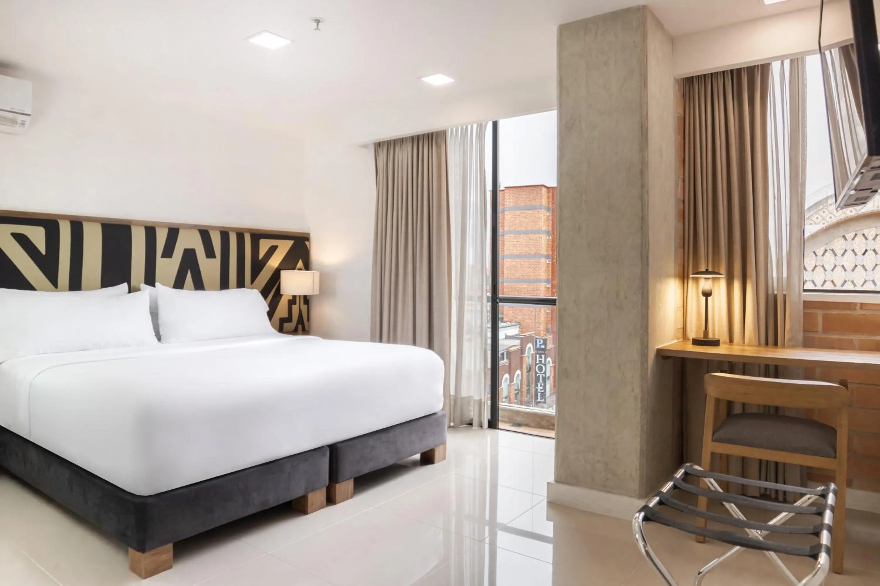 Bed in Origen Local Suites