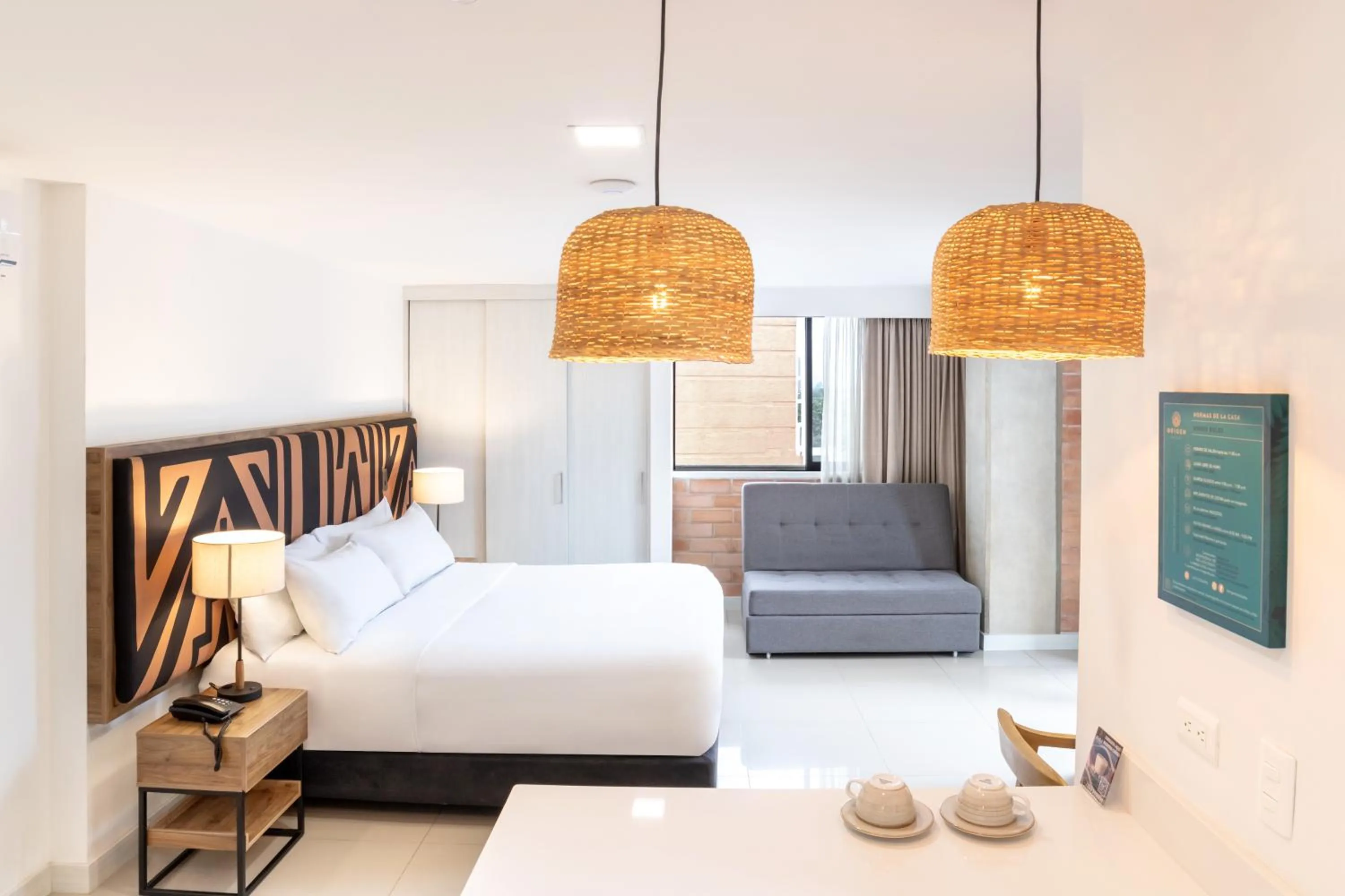 Bed in Origen Local Suites