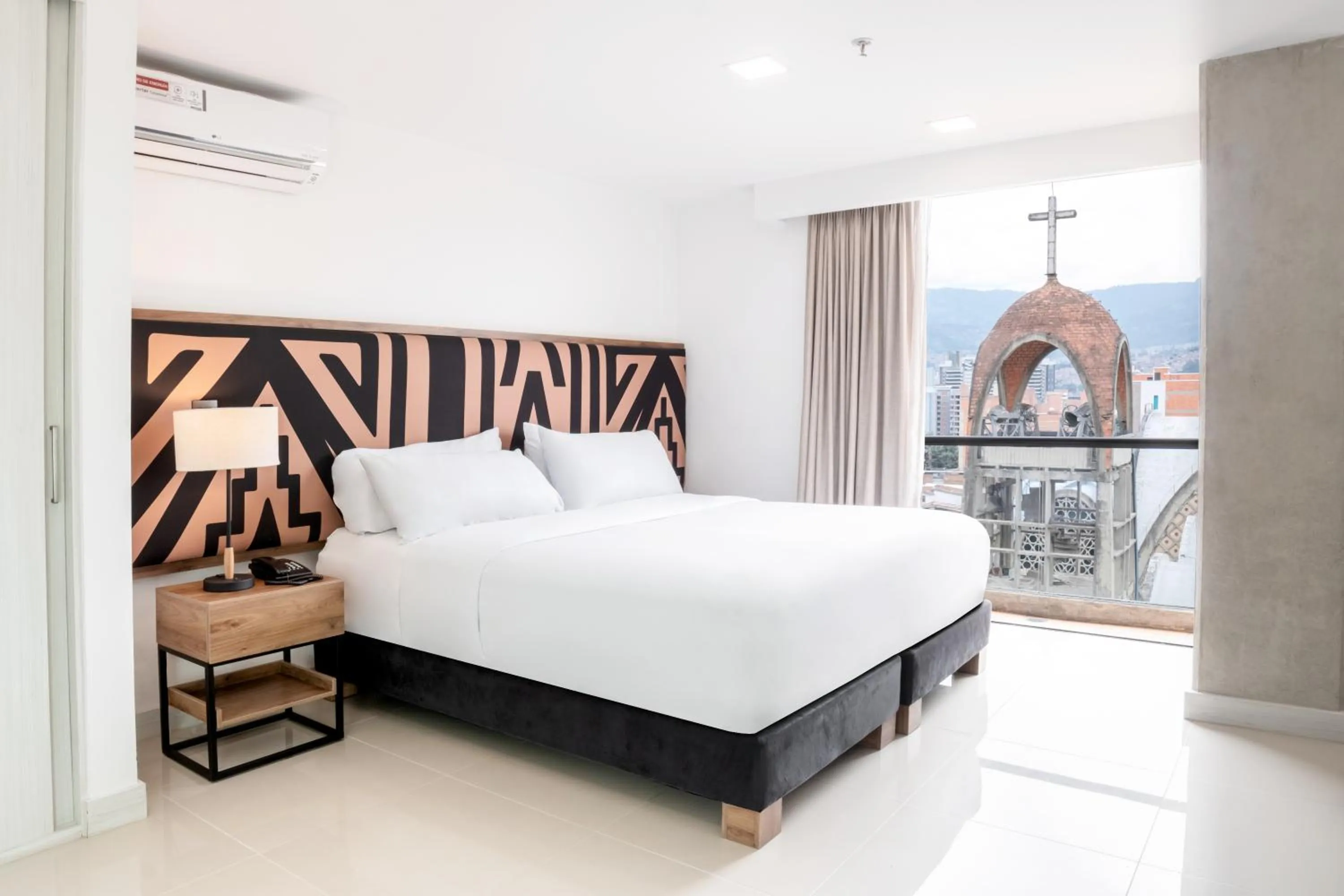 Bed in Origen Local Suites