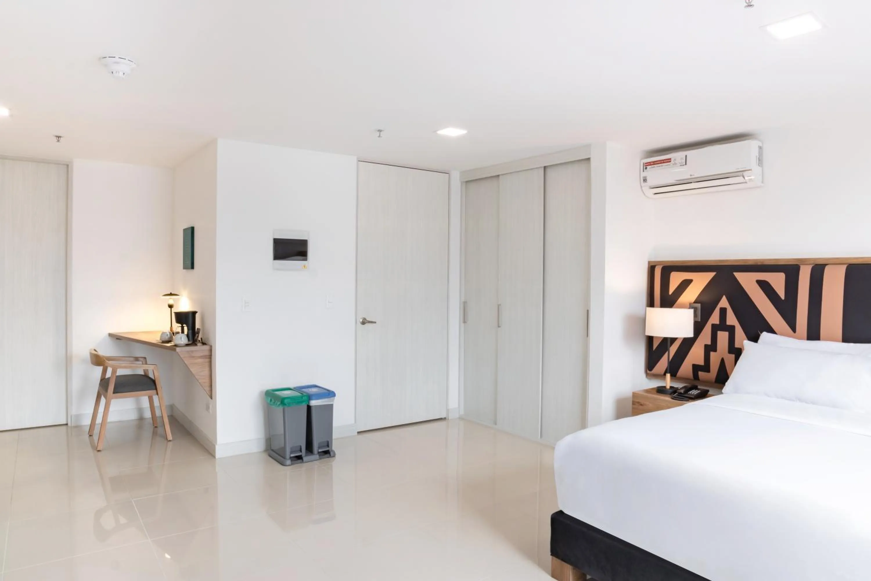 Bed in Origen Local Suites