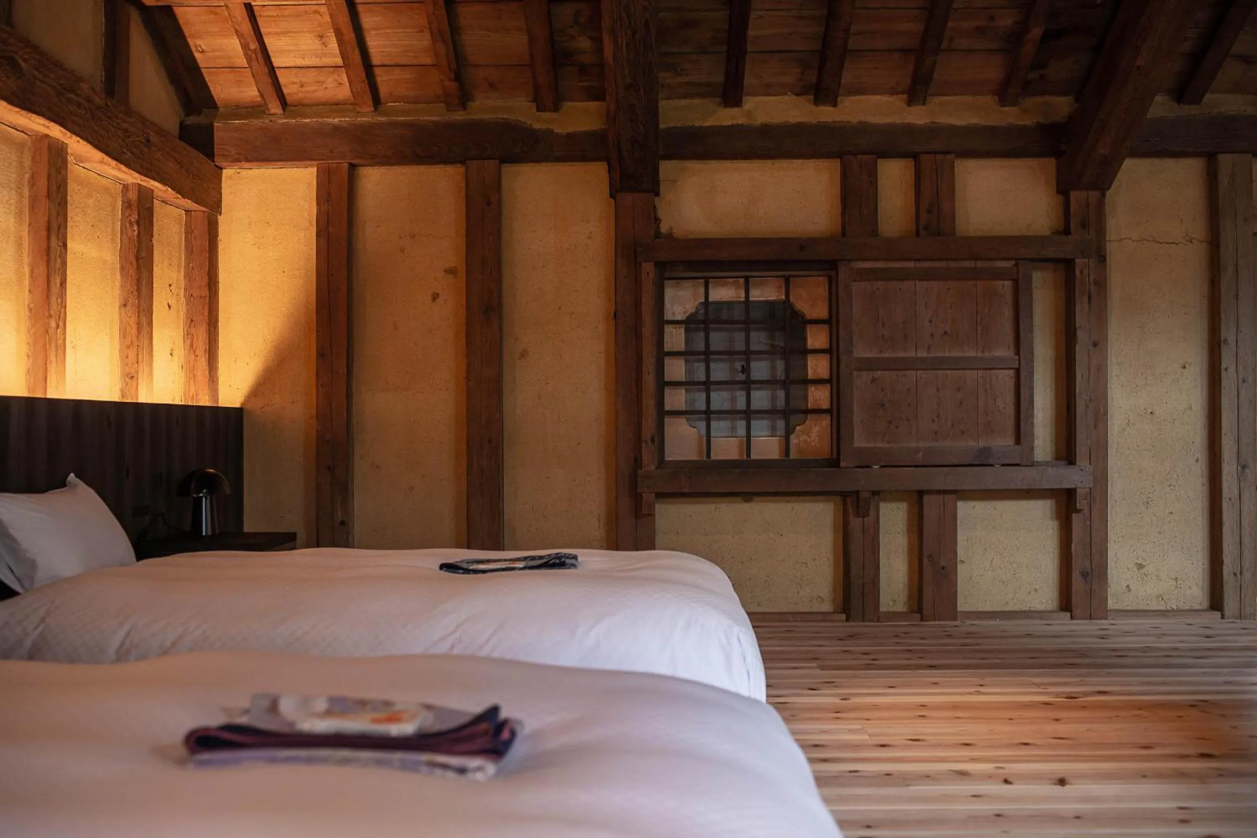 Bed in NIPPONIA HOTEL Ozu Castle Town