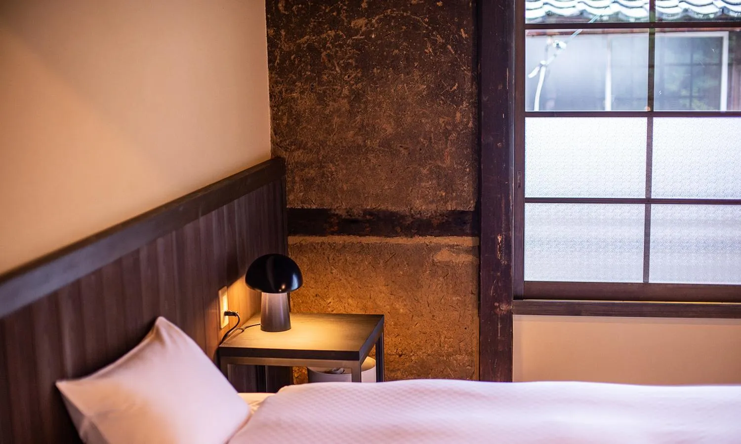 Bed in NIPPONIA HOTEL Ozu Castle Town