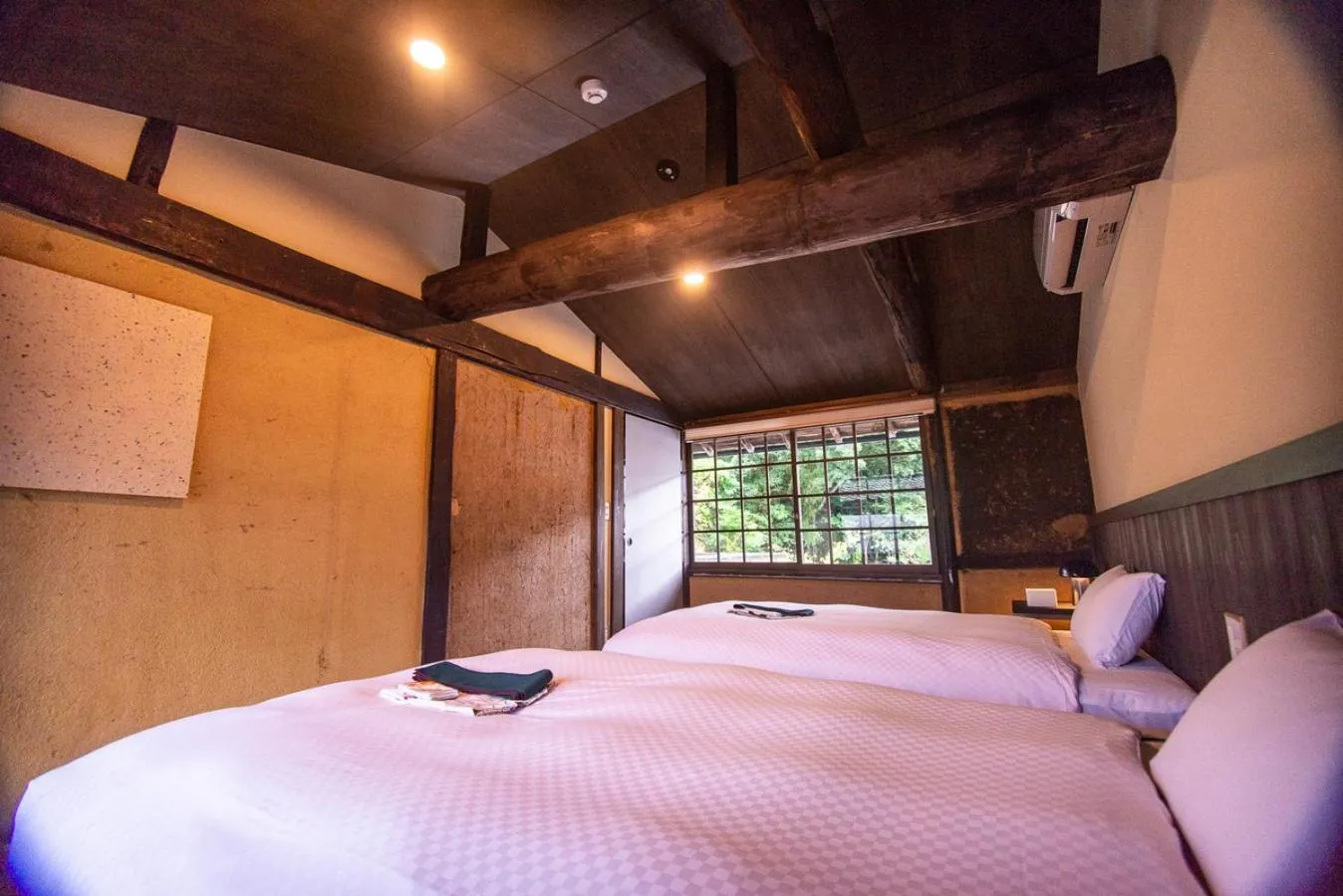 Bed in NIPPONIA HOTEL Ozu Castle Town