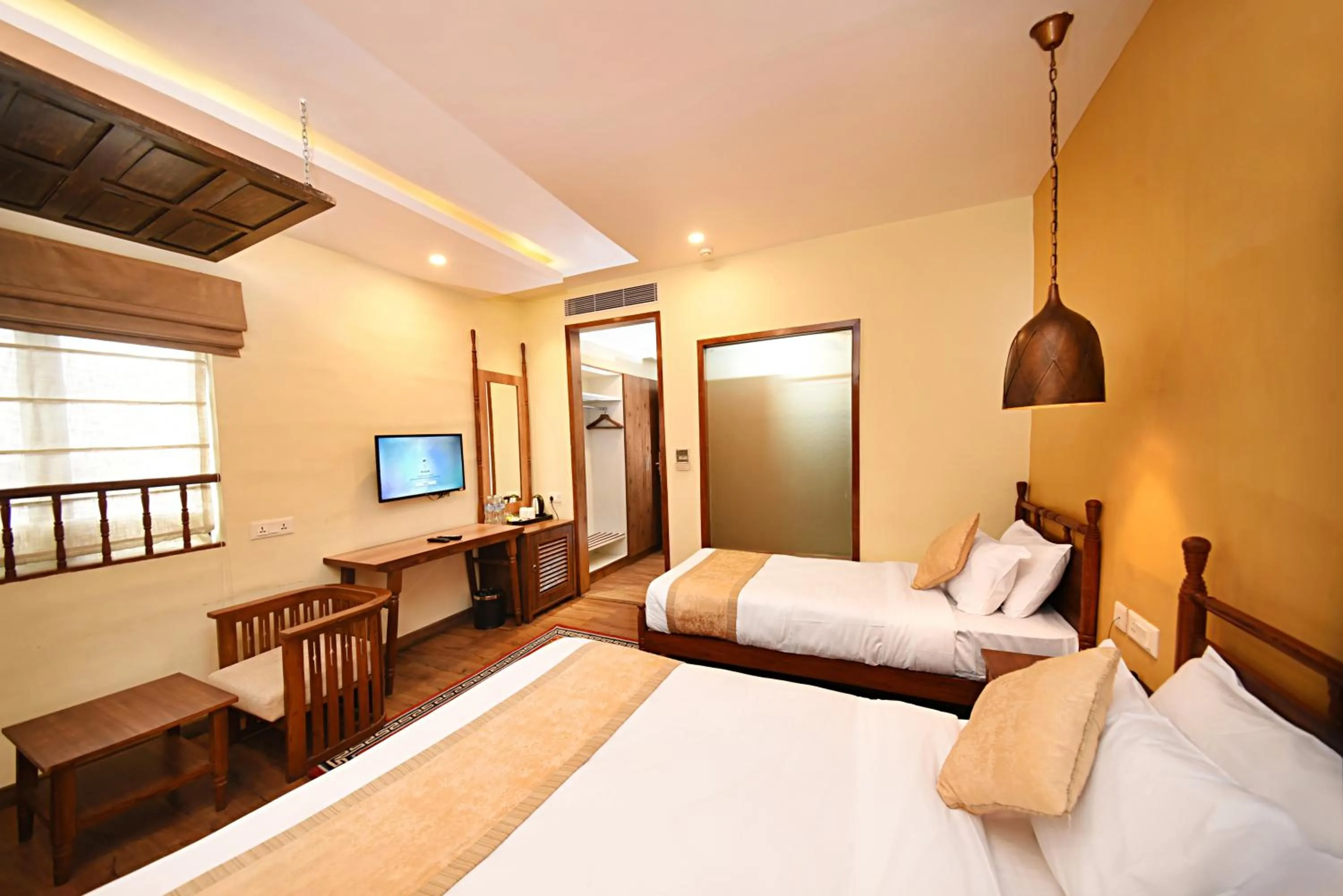 Photo of the whole room, Bed in Woodapple Hotel and Spa