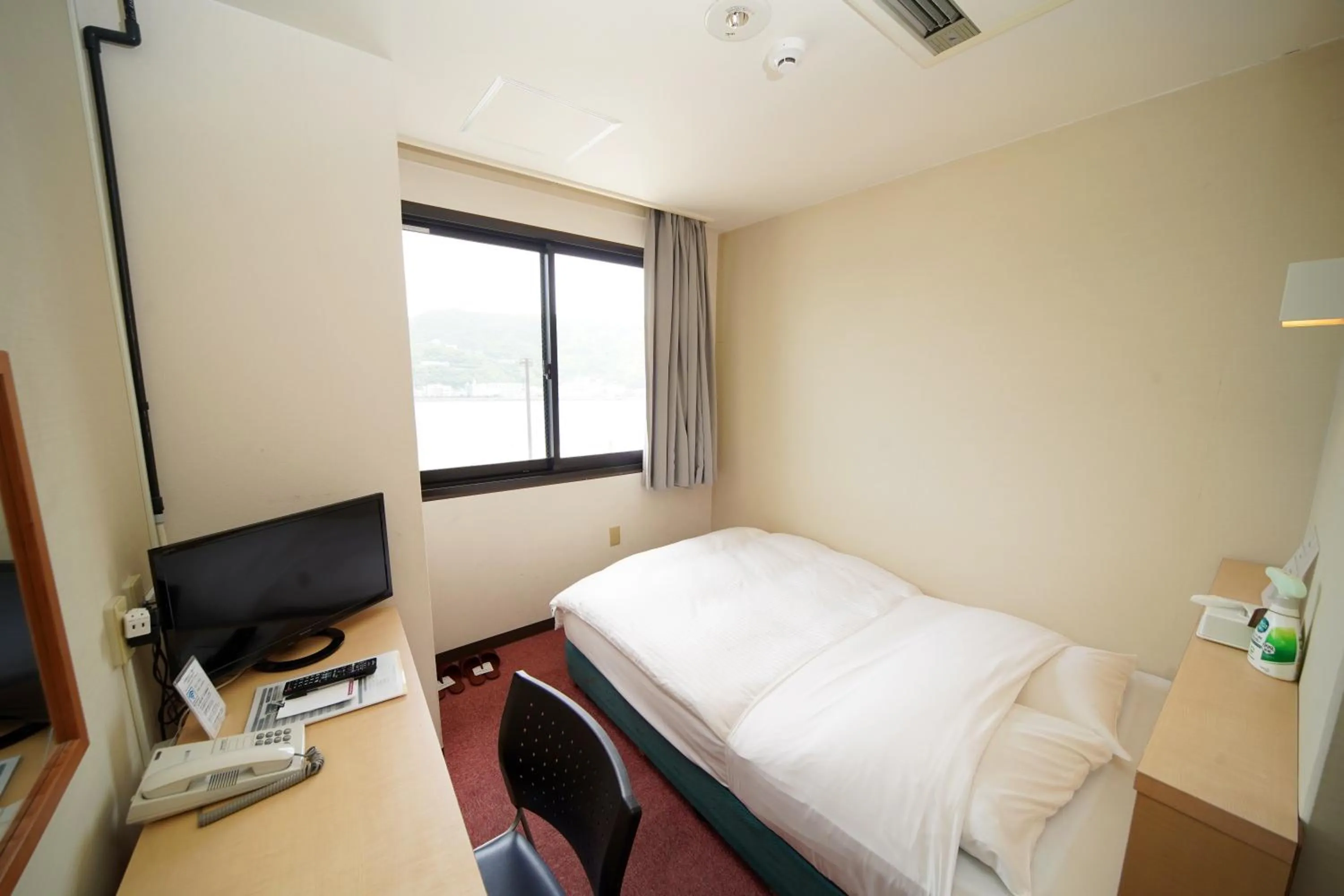 Bed in Amami Port Tower Hotel