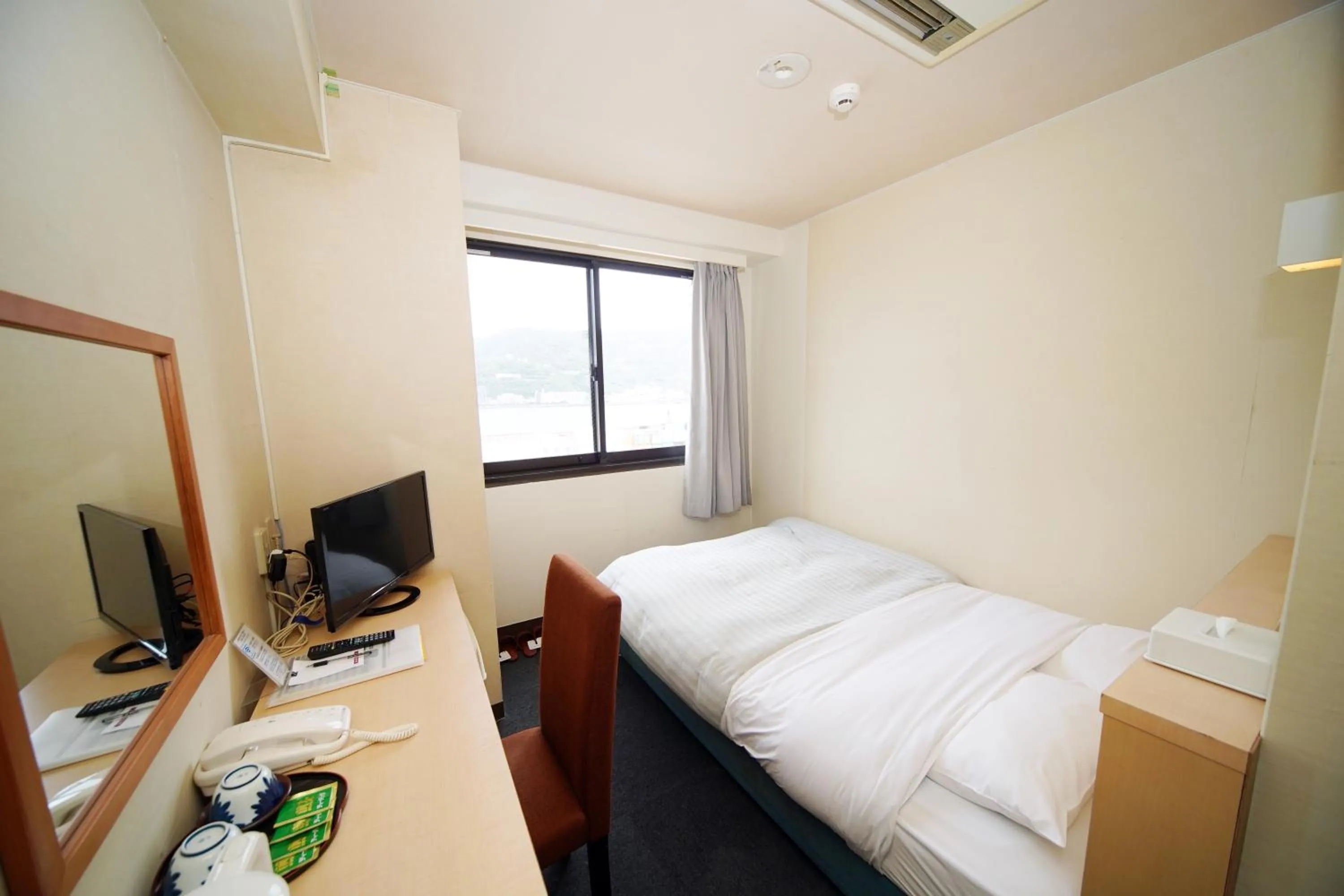 Bed in Amami Port Tower Hotel