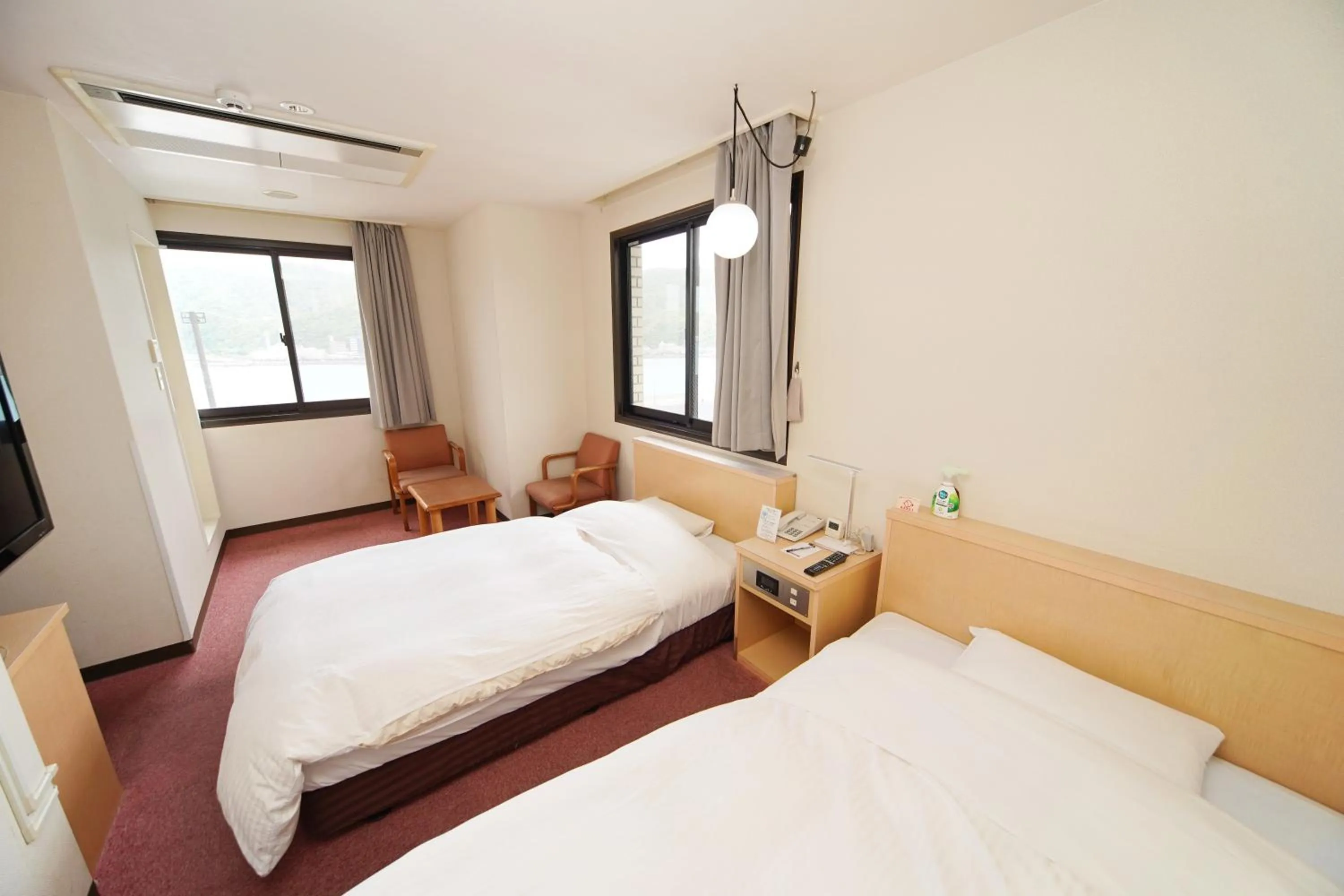Bed in Amami Port Tower Hotel