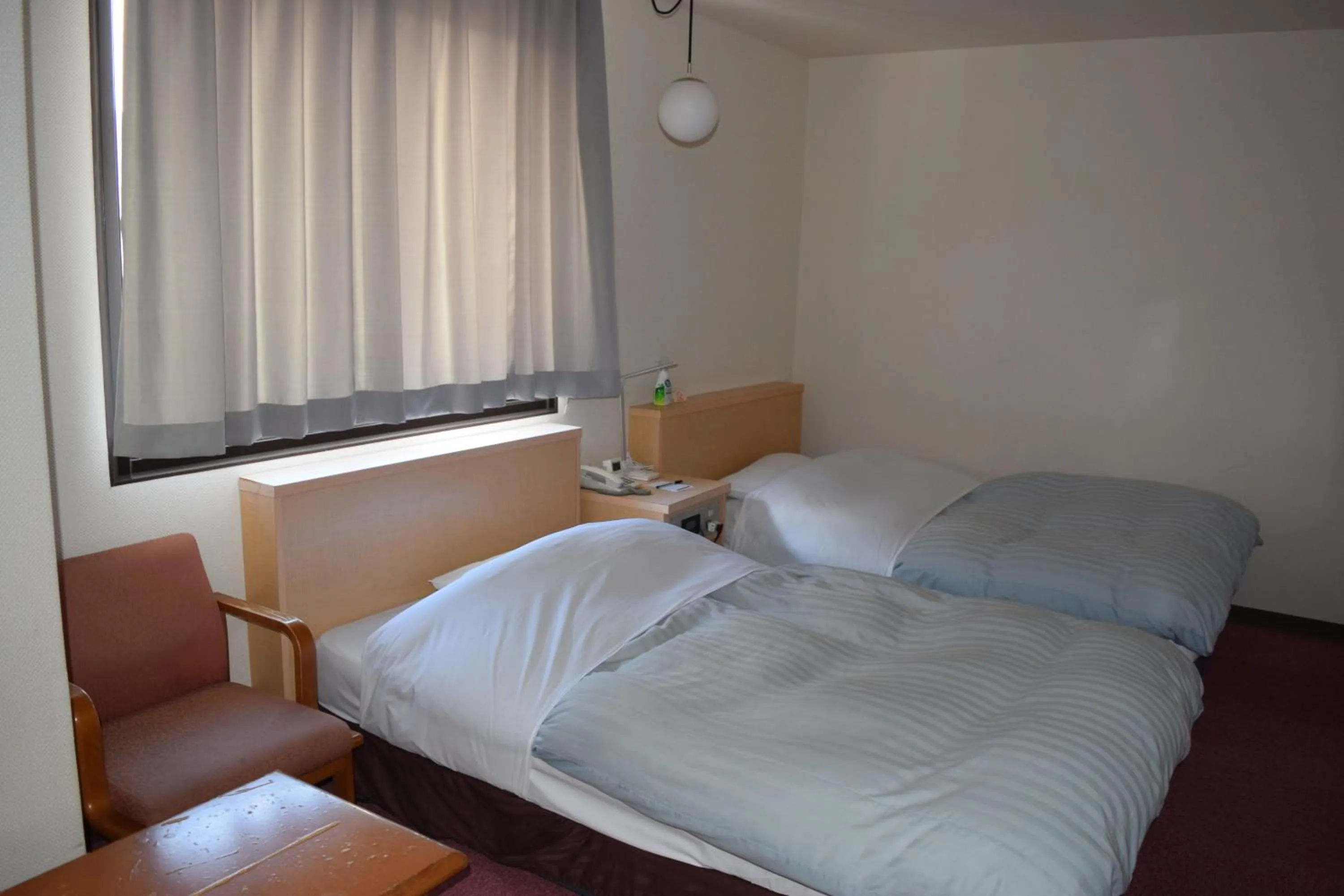 Bed in Amami Port Tower Hotel