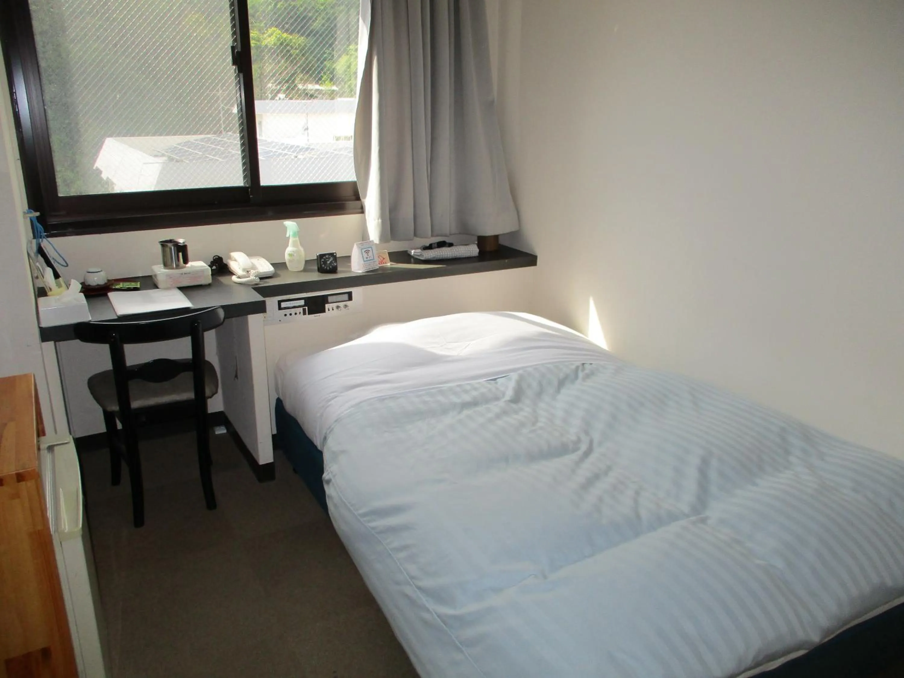 Bed in Amami Port Tower Hotel