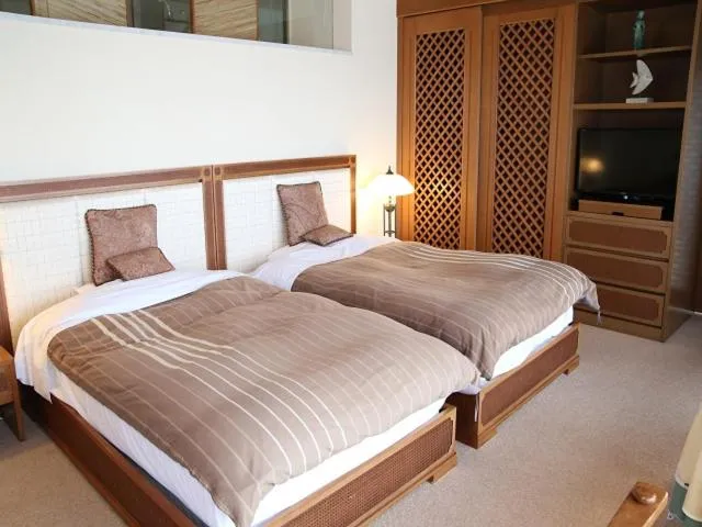 Bed in Nishiizu Crystal View Hotel