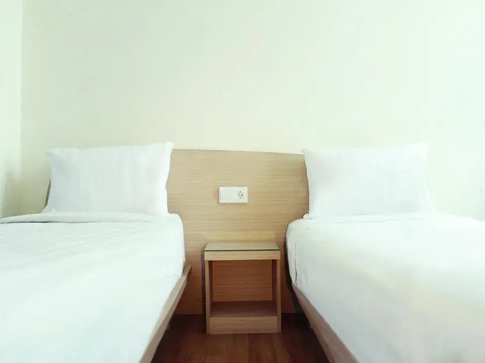Bed in Business Hotel Tomang