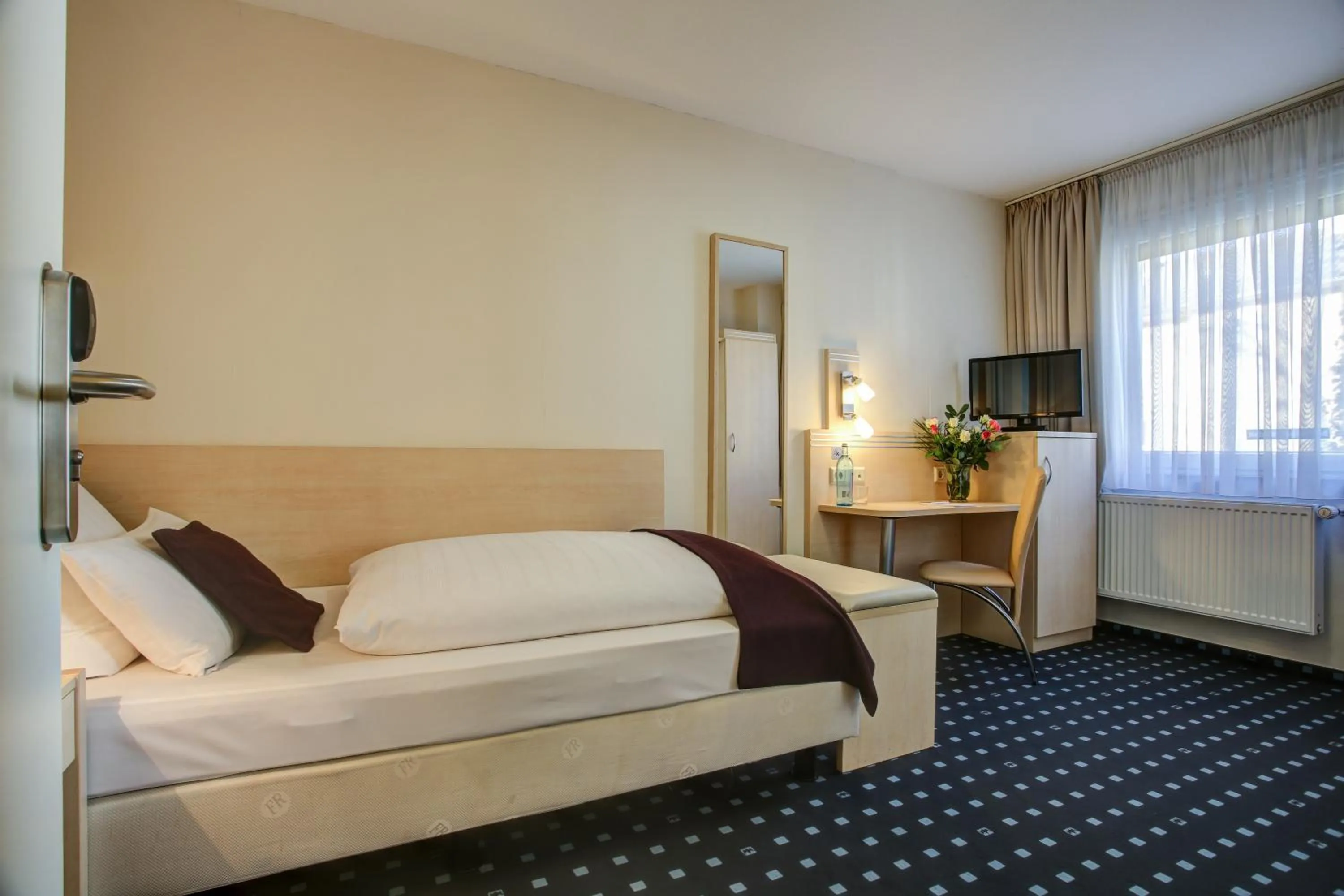 Bed in Rhein Neckar Hotel