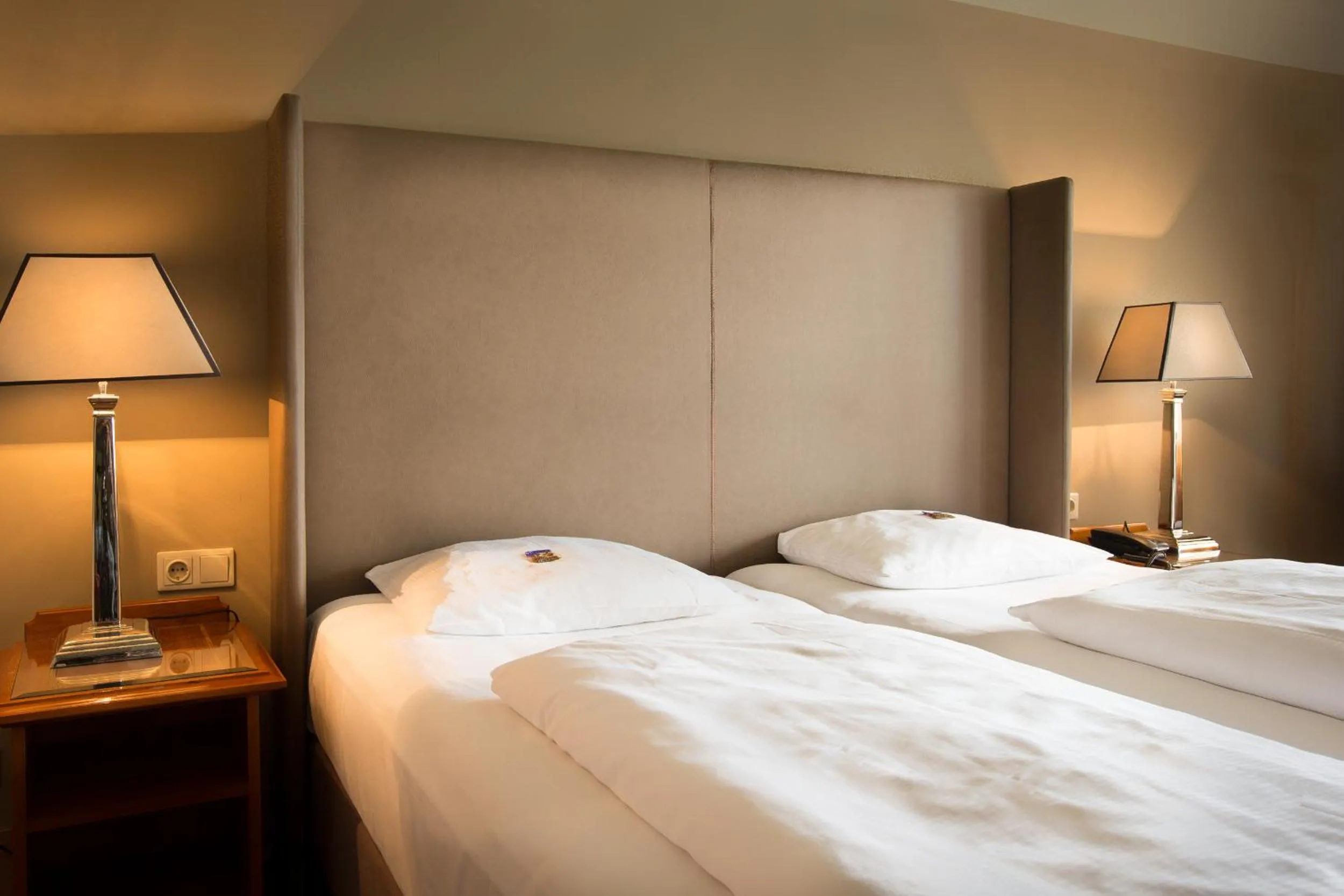 Bed in The Ascot Hotel