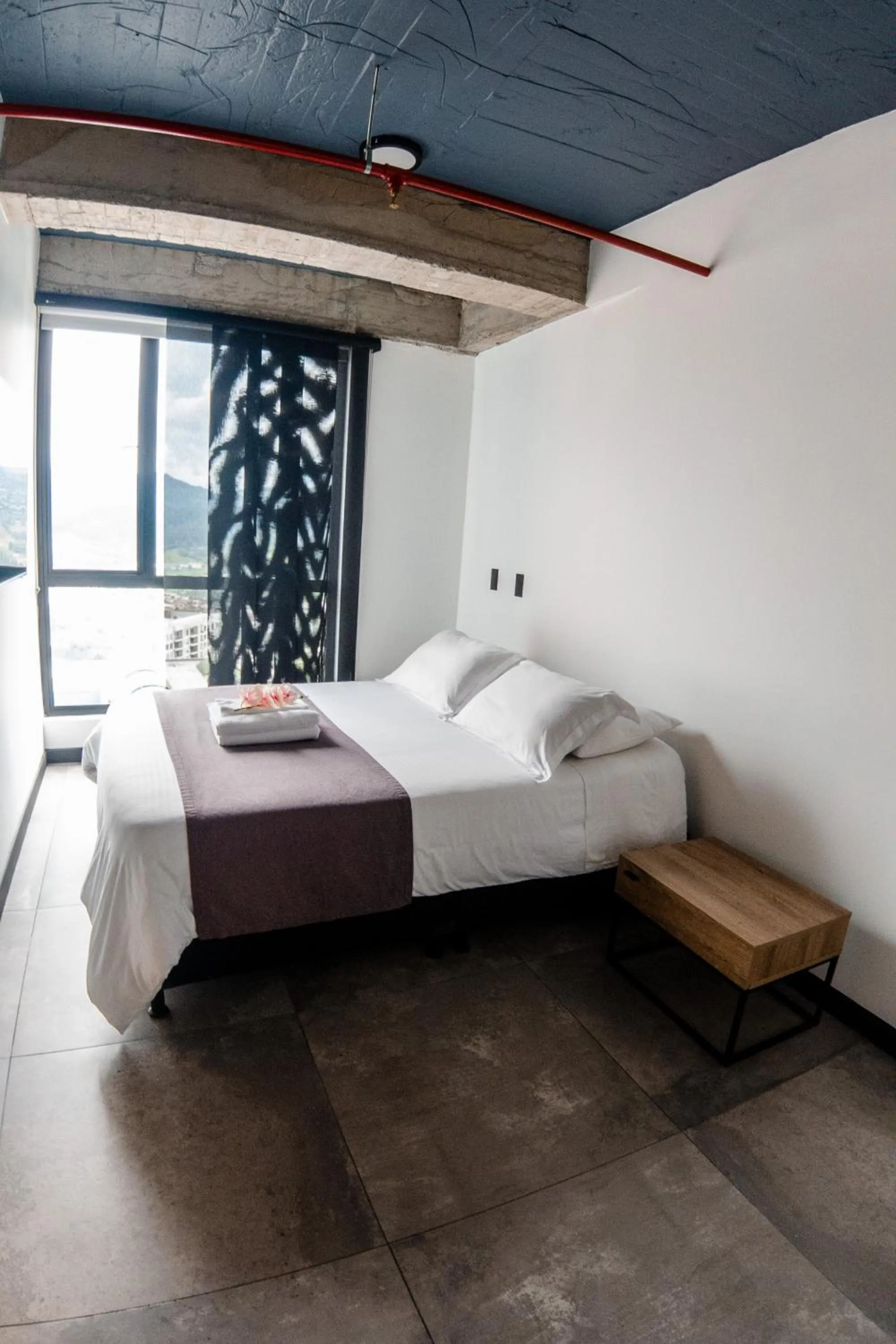 Bed in The Coffee Club Apartahotel