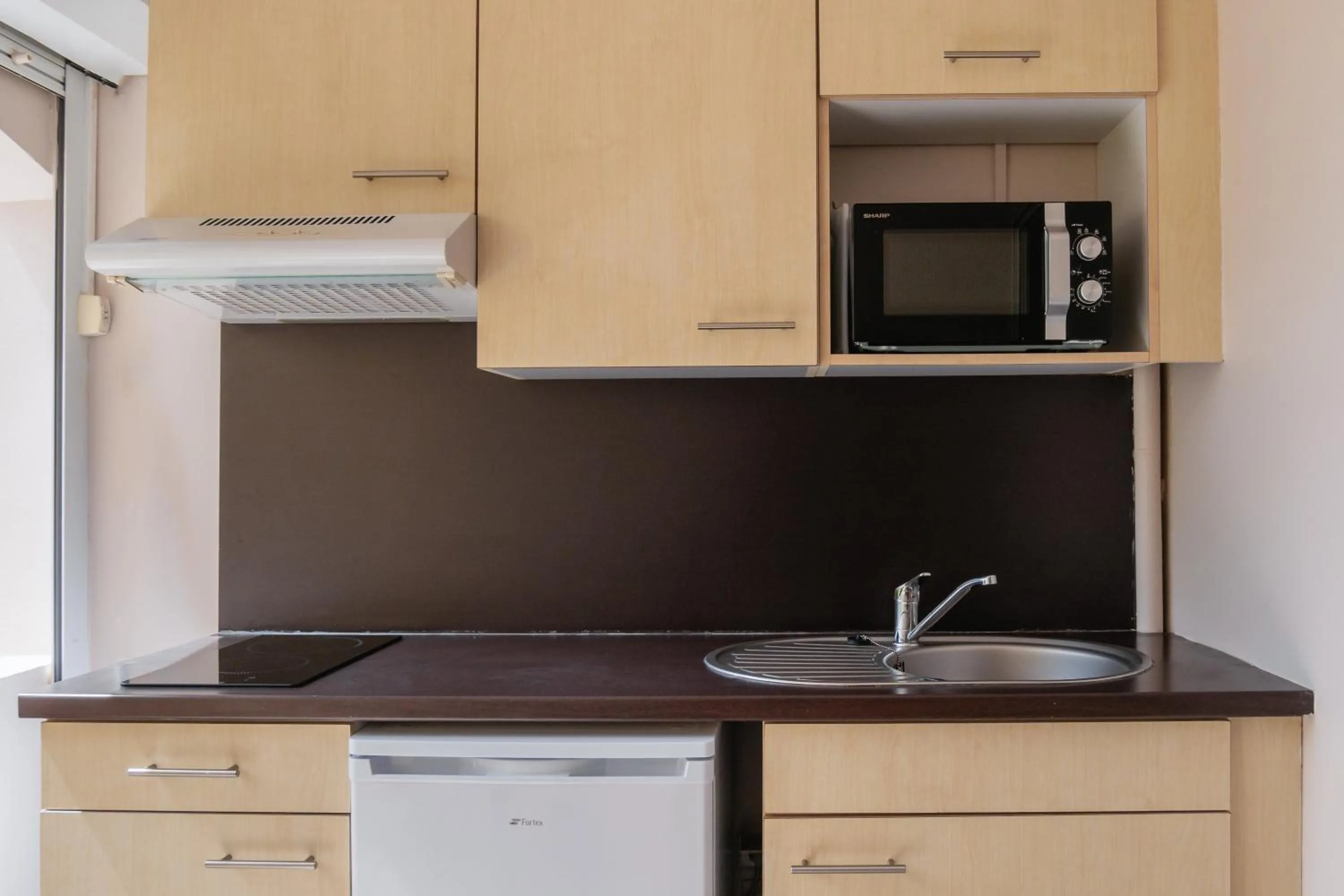 Kitchen or kitchenette in Hôtel Iloma