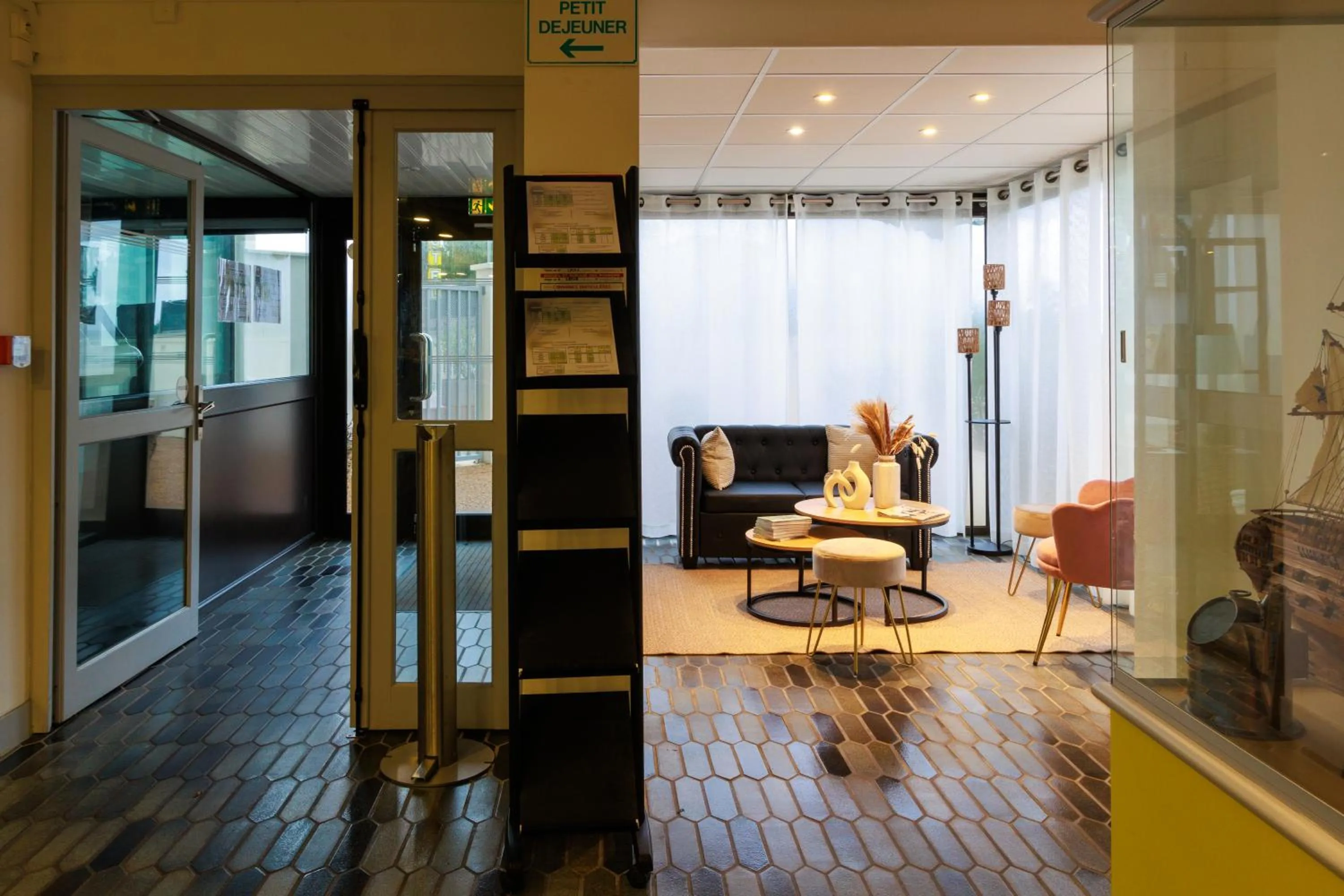 Seating area in Logis Hôtel Le Rochelois