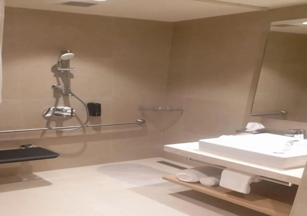 Bathroom in Holiday Inn Express & Suites Bengaluru Old Madras Road by IHG