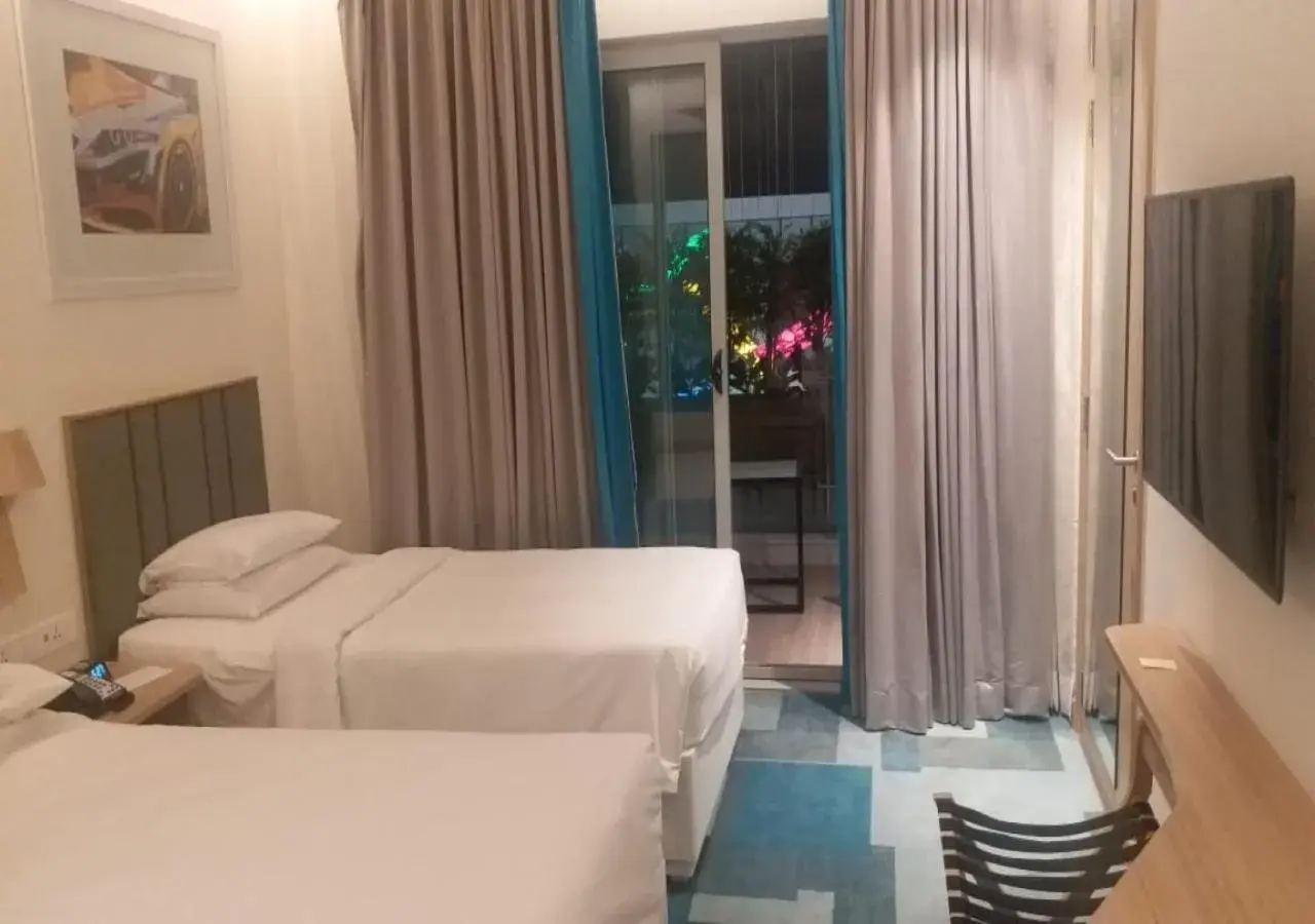 Balcony/Terrace, Bed in Holiday Inn Express & Suites Bengaluru Old Madras Road by IHG Balcony/Terrace, Bed in Holiday Inn Express & Suites Bengaluru Old Madras Road by IHG