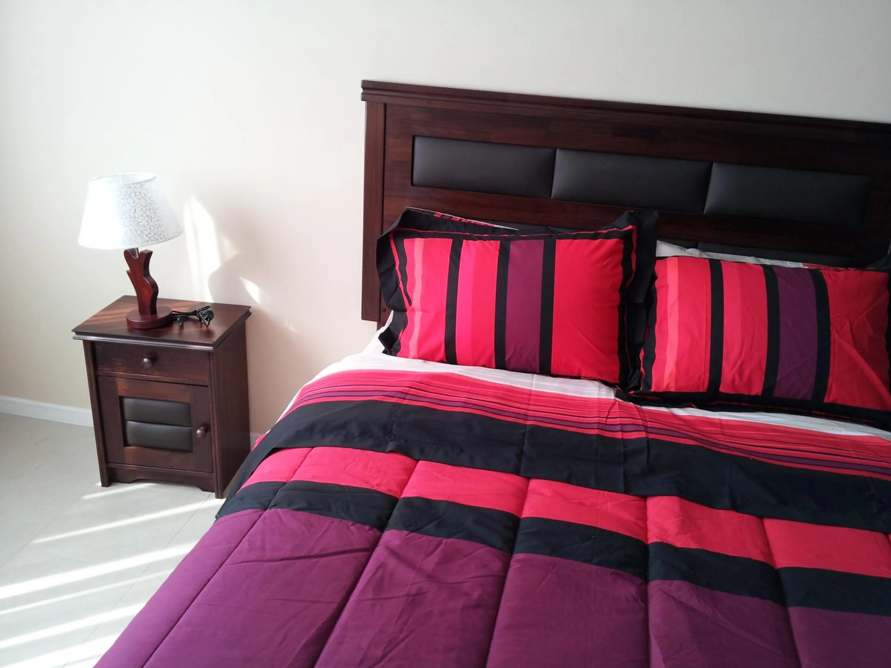 Bed in Hotel Astore Suites
