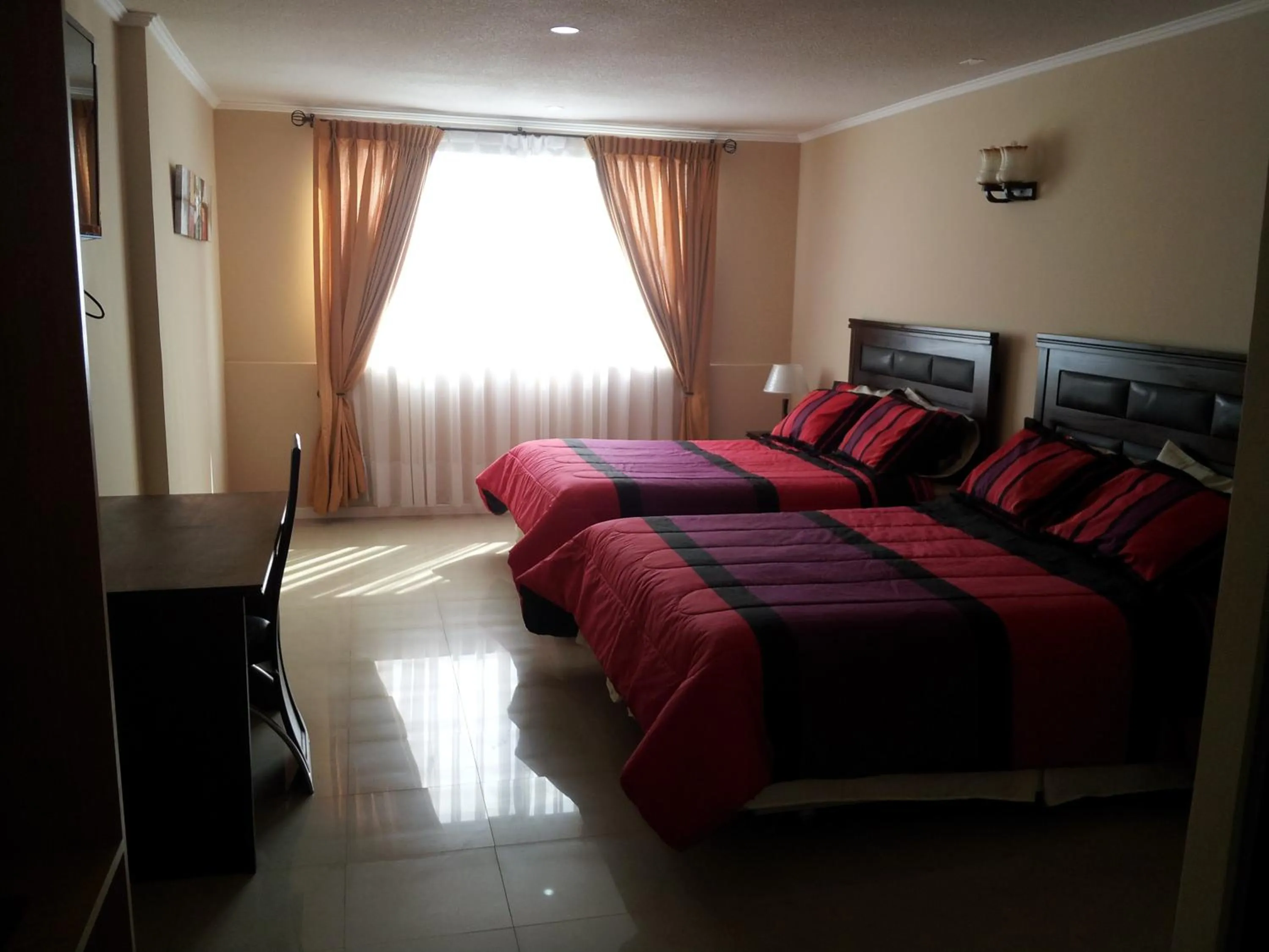 Bed in Hotel Astore Suites